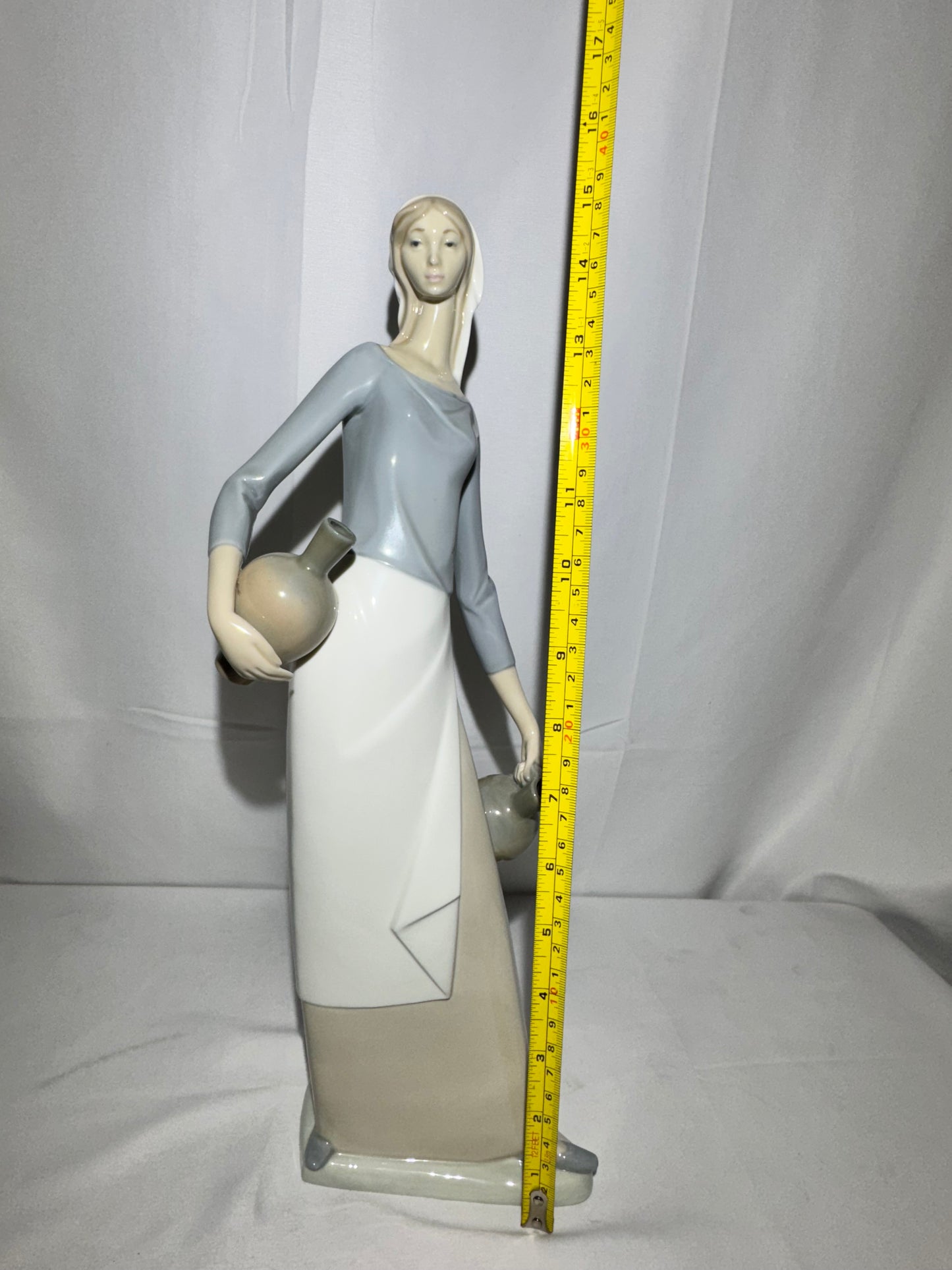 Lladro NAO Porcelain Figurine – “The Jug Carrier” (Water Carrier with Jugs) – Designed by Fulgencio Garcia, 1974