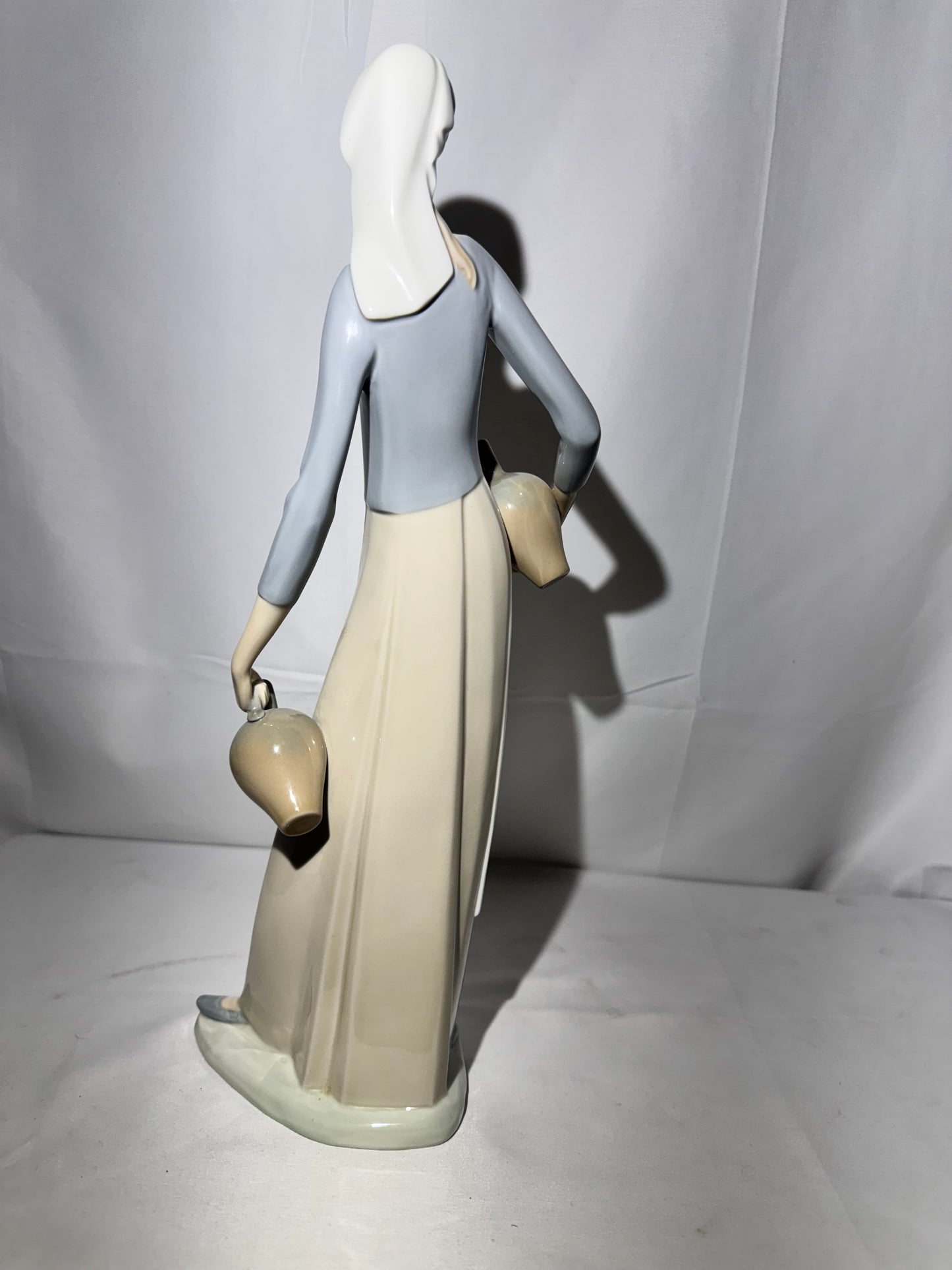 Lladro NAO Porcelain Figurine – “The Jug Carrier” (Water Carrier with Jugs) – Designed by Fulgencio Garcia, 1974