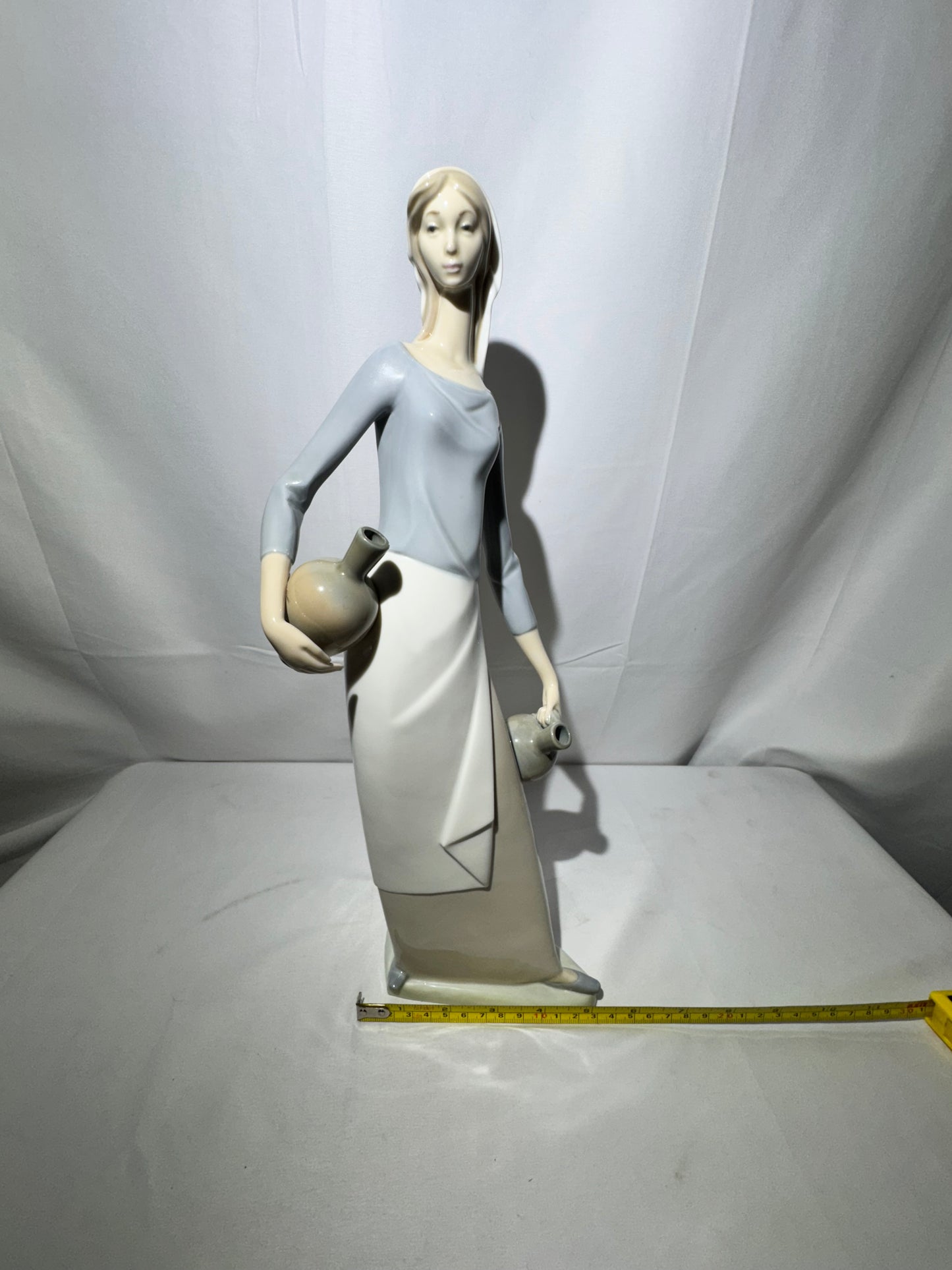 Lladro NAO Porcelain Figurine – “The Jug Carrier” (Water Carrier with Jugs) – Designed by Fulgencio Garcia, 1974