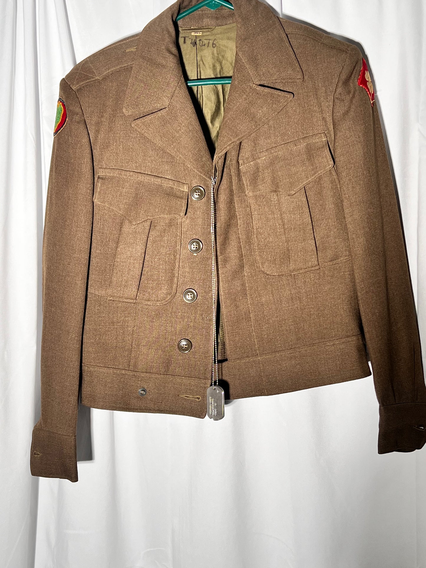 World War II lot - military uniform- dog tags- 2 duffel bags- decorated and patches on uniform