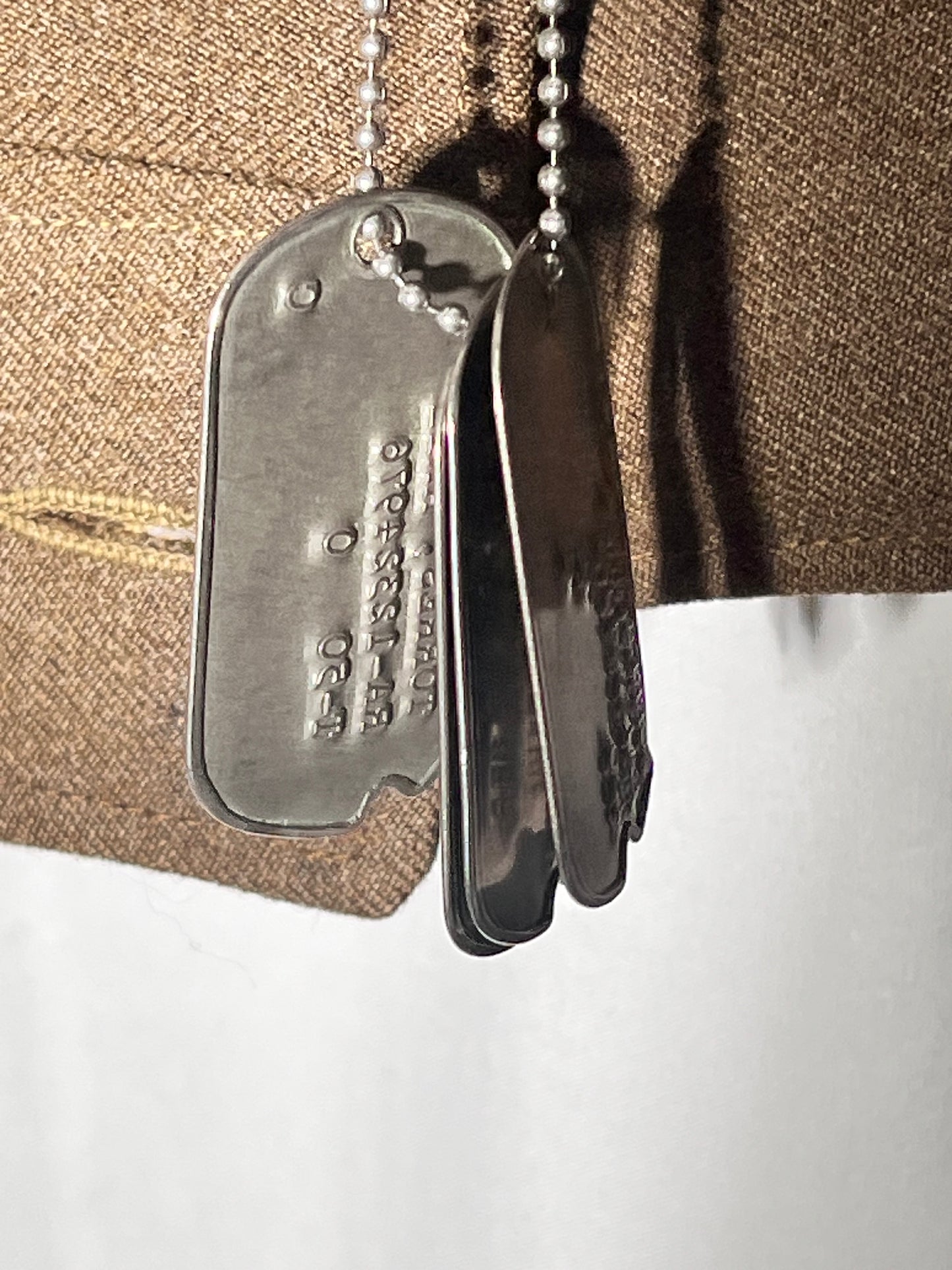 World War II lot - military uniform- dog tags- 2 duffel bags- decorated and patches on uniform