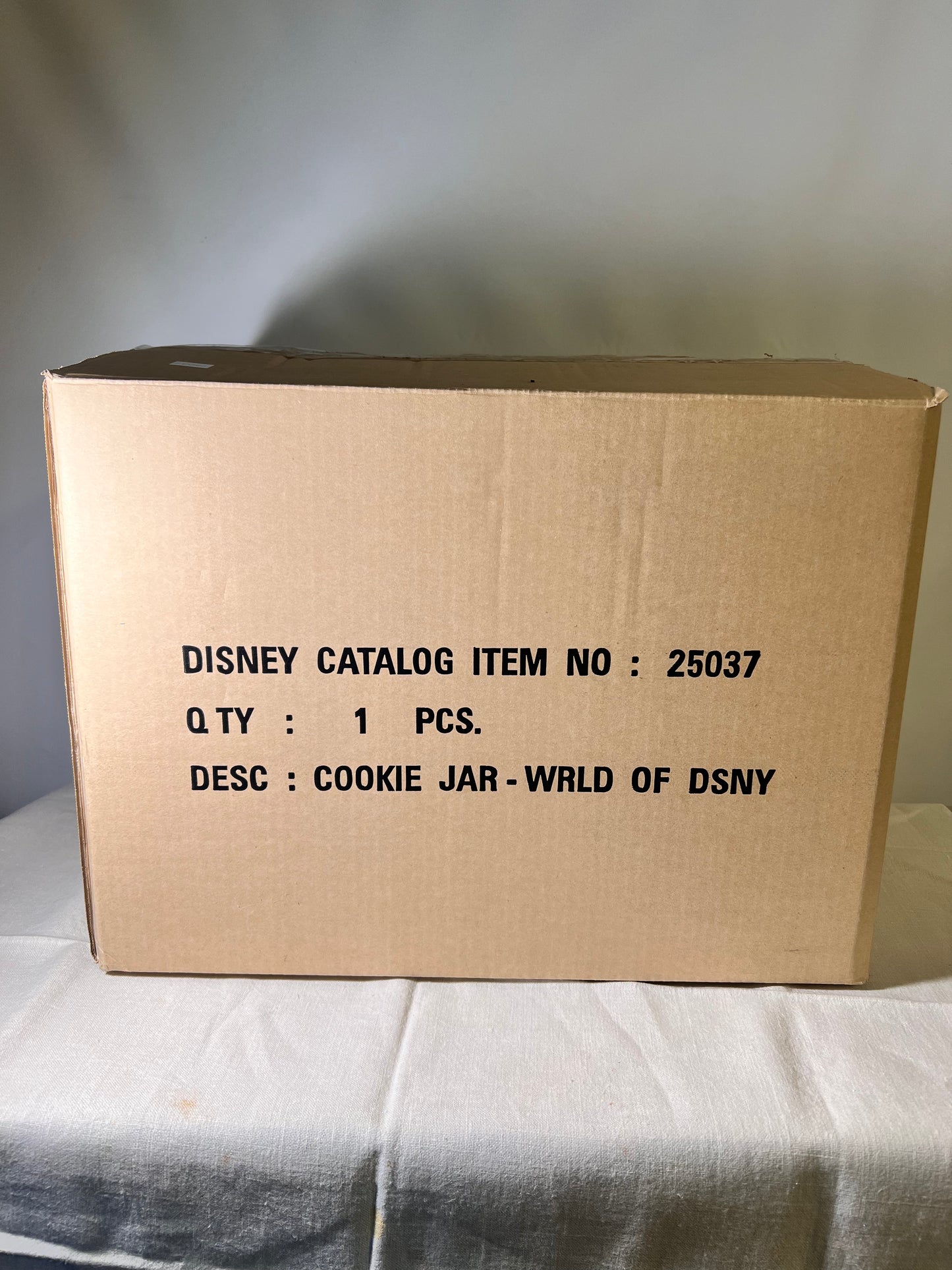 Dumbo, dopey, Pinocchio, and Mickey Mouse peeking out of a present -cookie jar-Disney-#25037