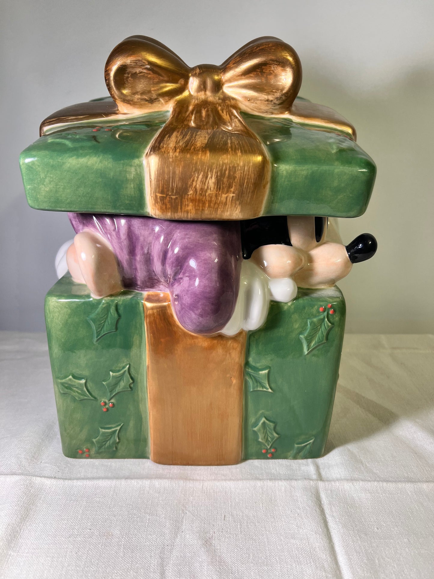 Dumbo, dopey, Pinocchio, and Mickey Mouse peeking out of a present -cookie jar-Disney-#25037