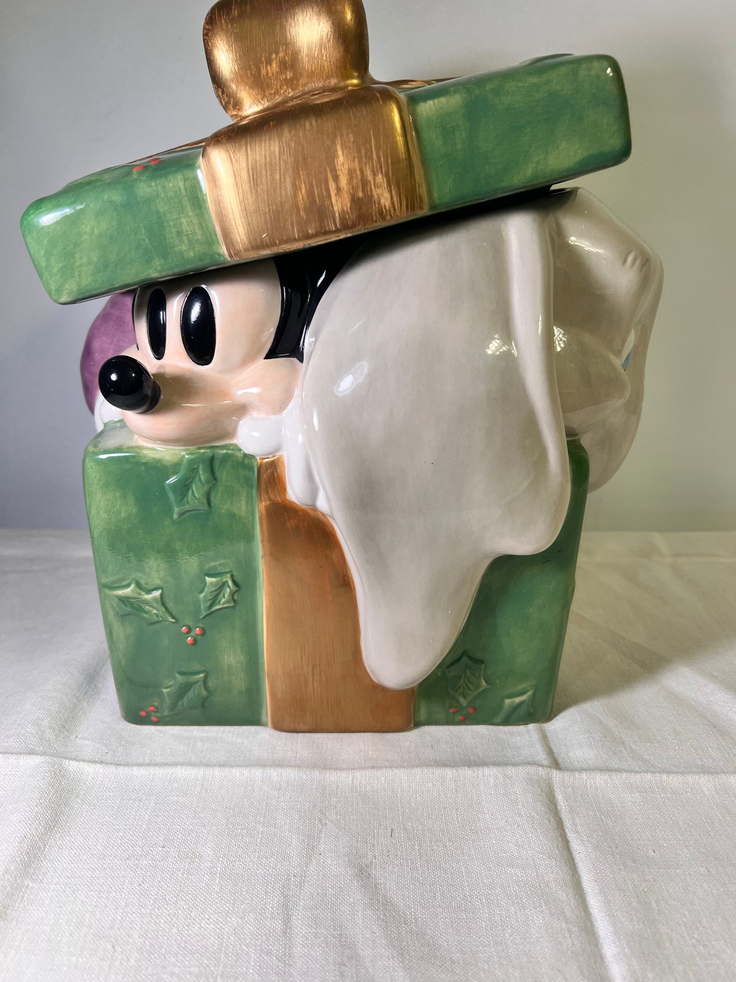 Dumbo, dopey, Pinocchio, and Mickey Mouse peeking out of a present -cookie jar-Disney-#25037