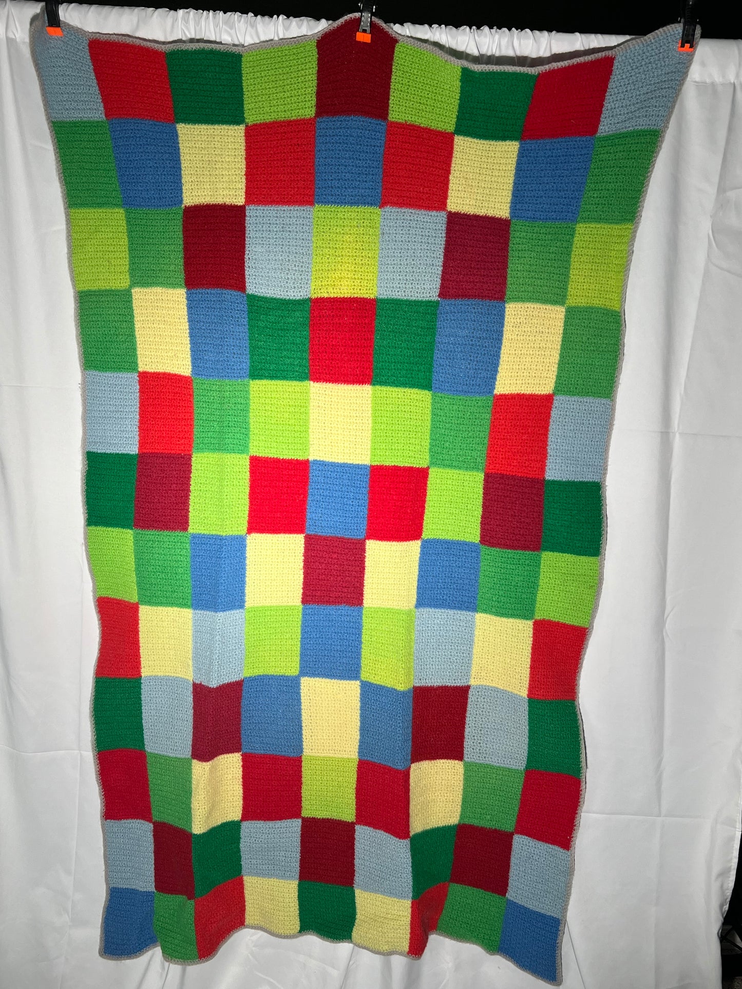 Afghan - multi-colored - 40” x 69” - blue,green,red, yellow- small squares -hand crochet blanket