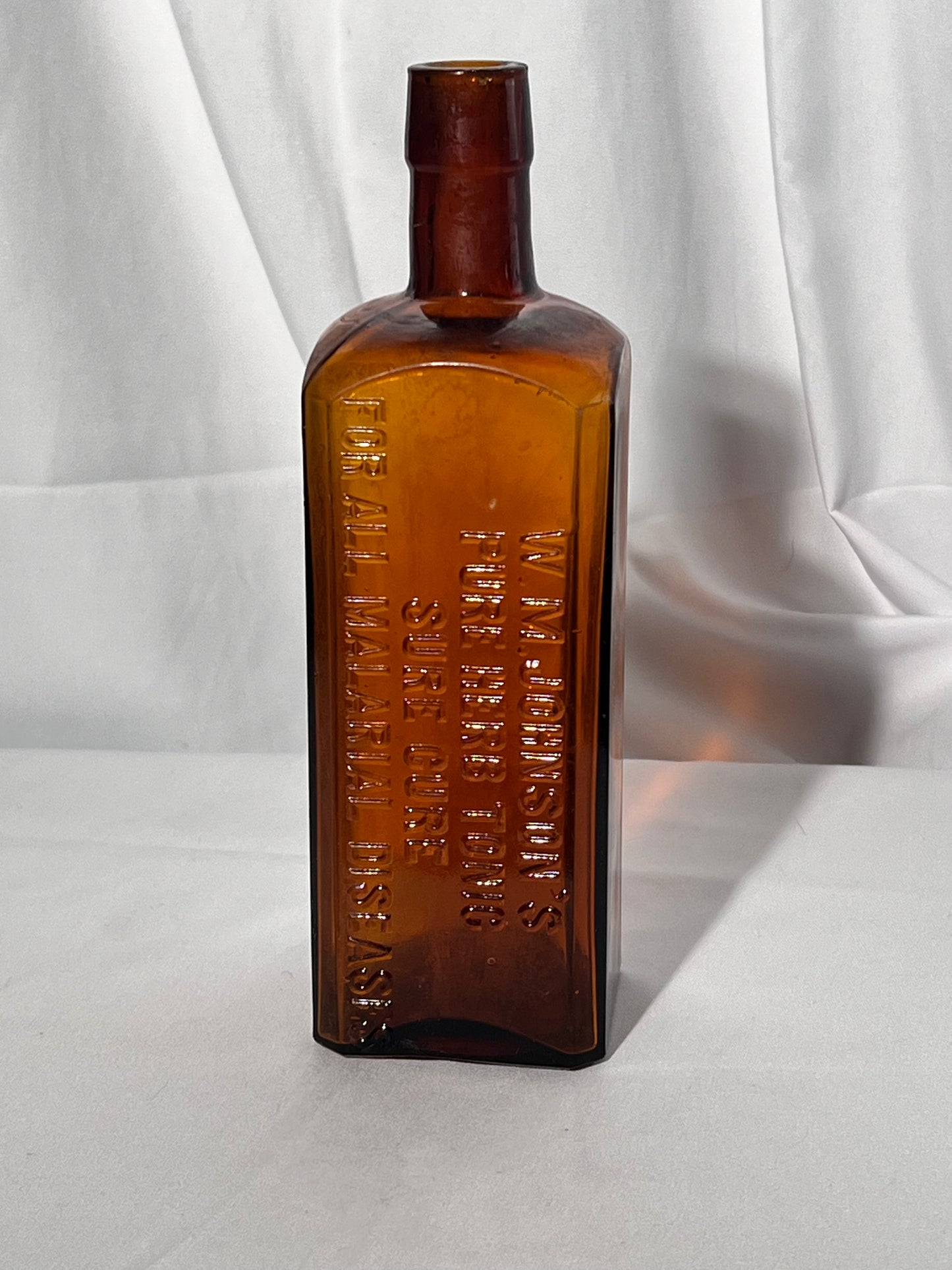 Antique Medicine Bottle - 9” W.M. Johnson’s - Pure Herb Tonic- Sure Cure - For All Malarial Diseases - Amber glass