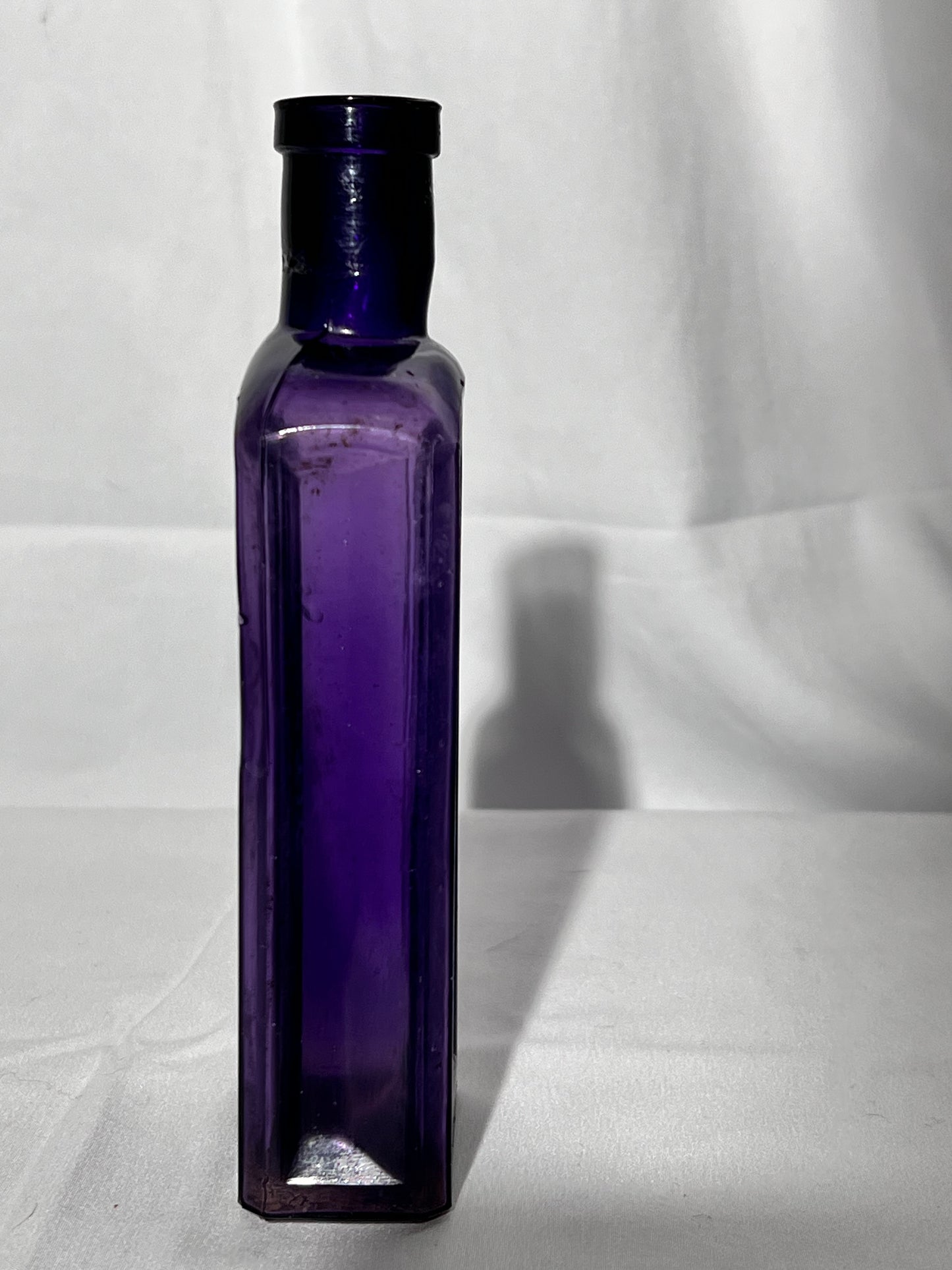 Antique- 6 1/2” glass bottle - purple- no markings