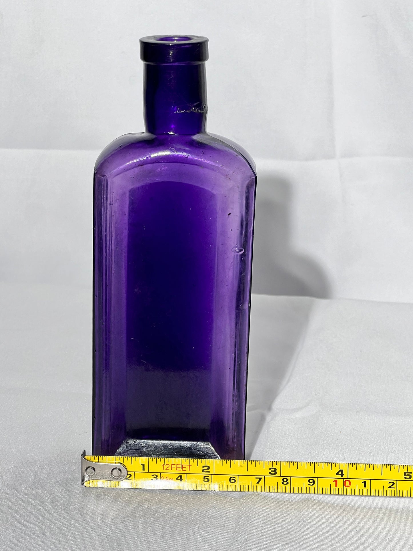 Antique- 6 1/2” glass bottle - purple- no markings