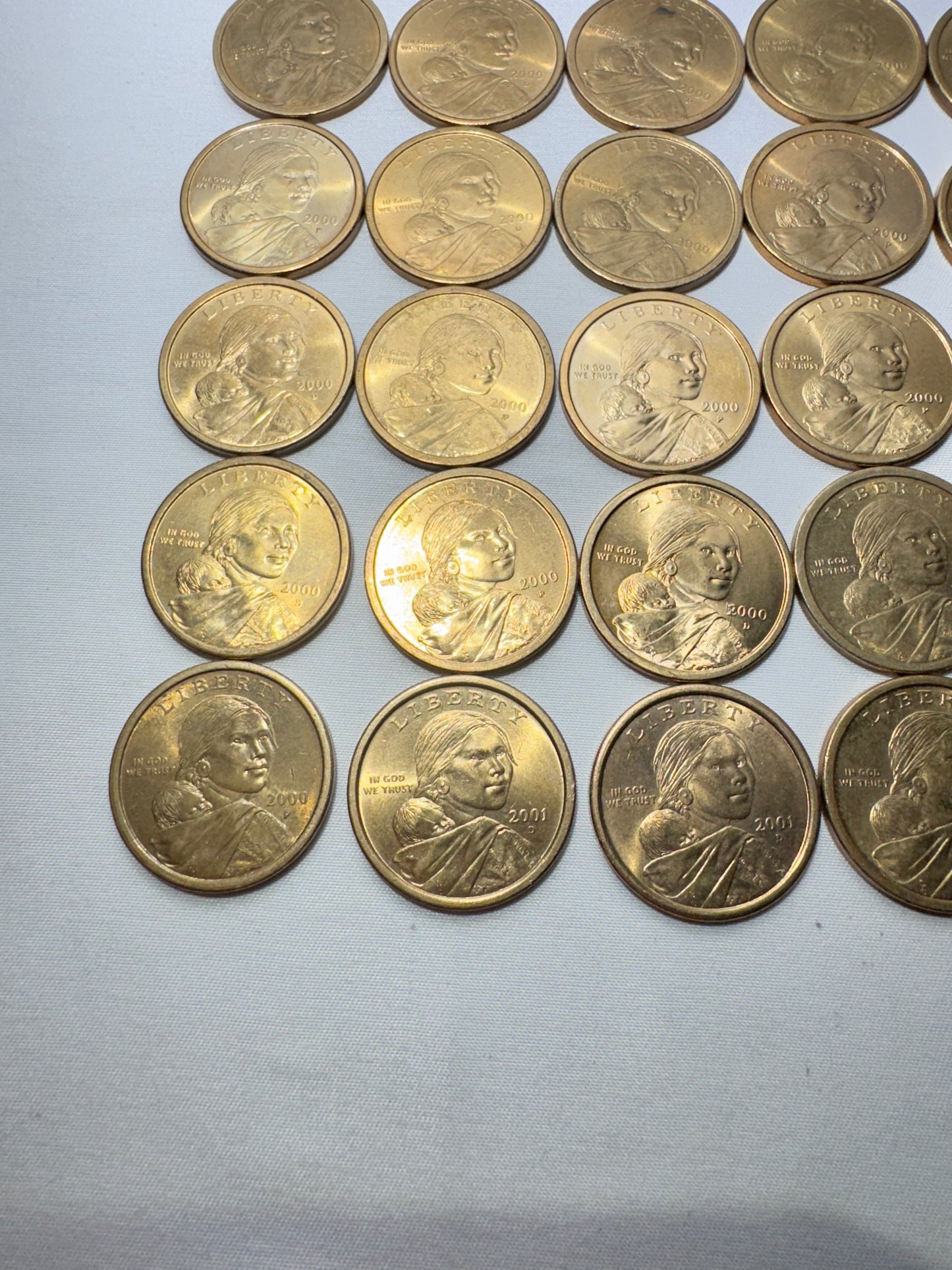 Lot of 25 United States Sacagawea One Dollar Coins – 2000, 2001 & 2002 – One Colorized Coin Included