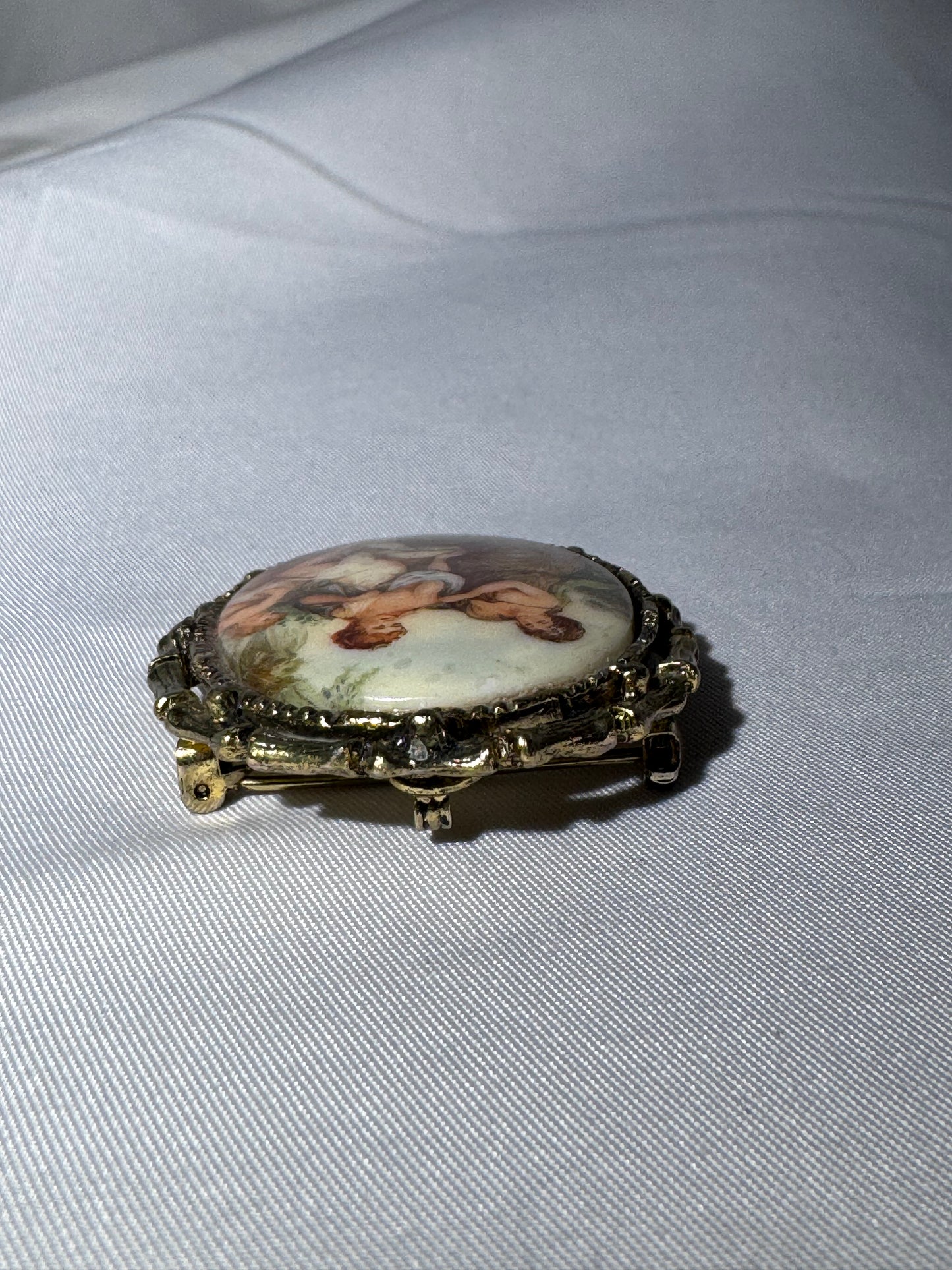 Vintage French Limoges Porcelain Miniature Brooch – Classical Mythology Scene – Ornate Gold-Tone Frame