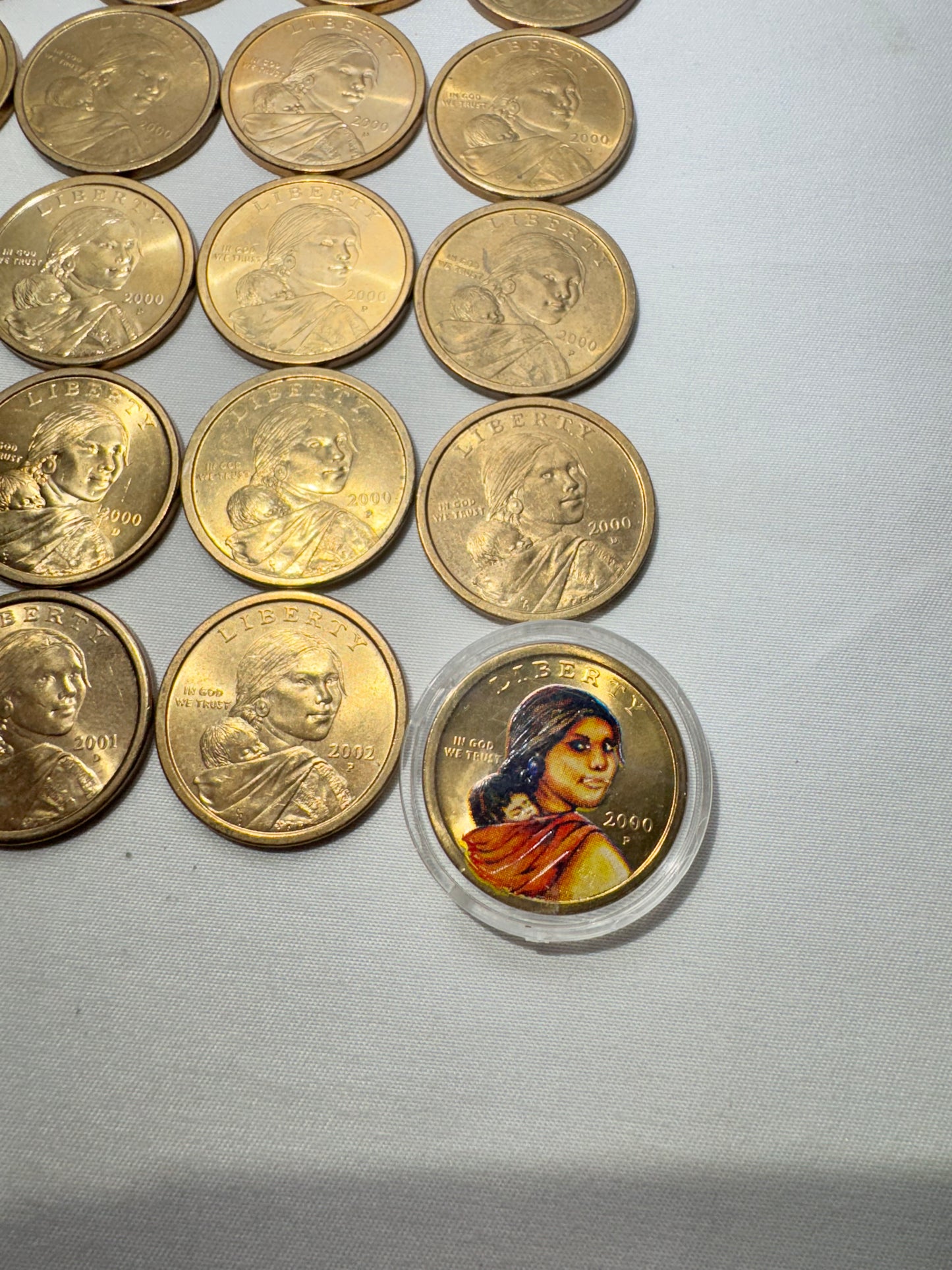 Lot of 25 United States Sacagawea One Dollar Coins – 2000, 2001 & 2002 – One Colorized Coin Included