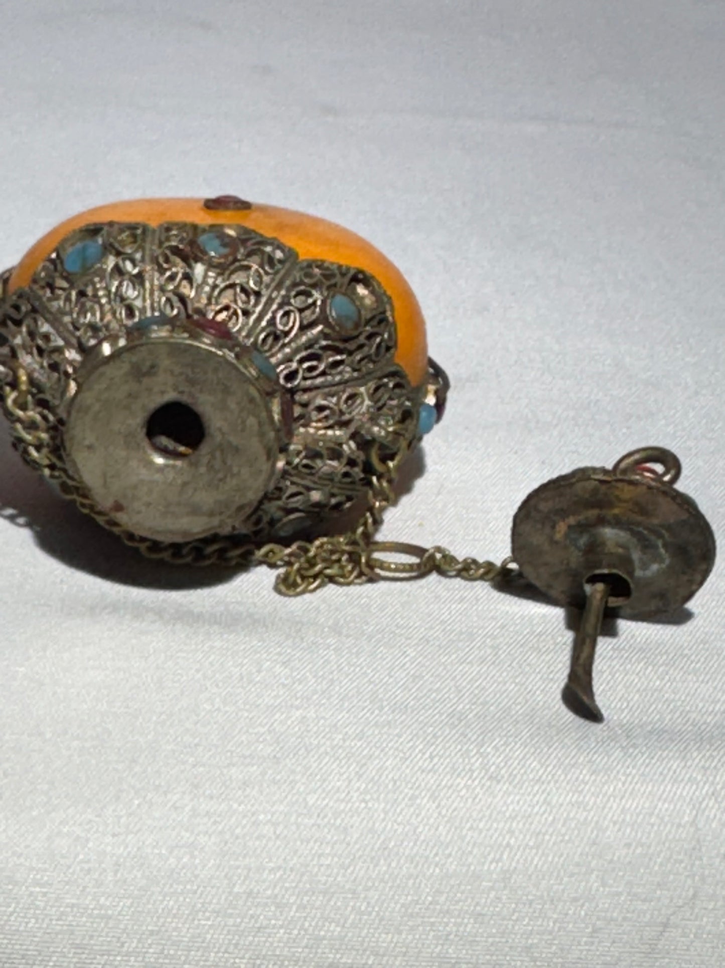 Antique Tibetan Silver Snuff Bottle with Coral and Turquoise Inlay – Ornate Metalwork & Chain Stopper