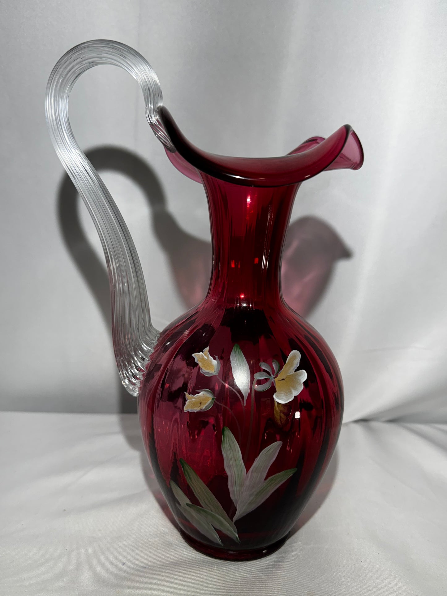 Fenton Art Glass Cranberry “Pansies” Hand-Painted Pitcher – 10.5” Fluted Ribbon Handle