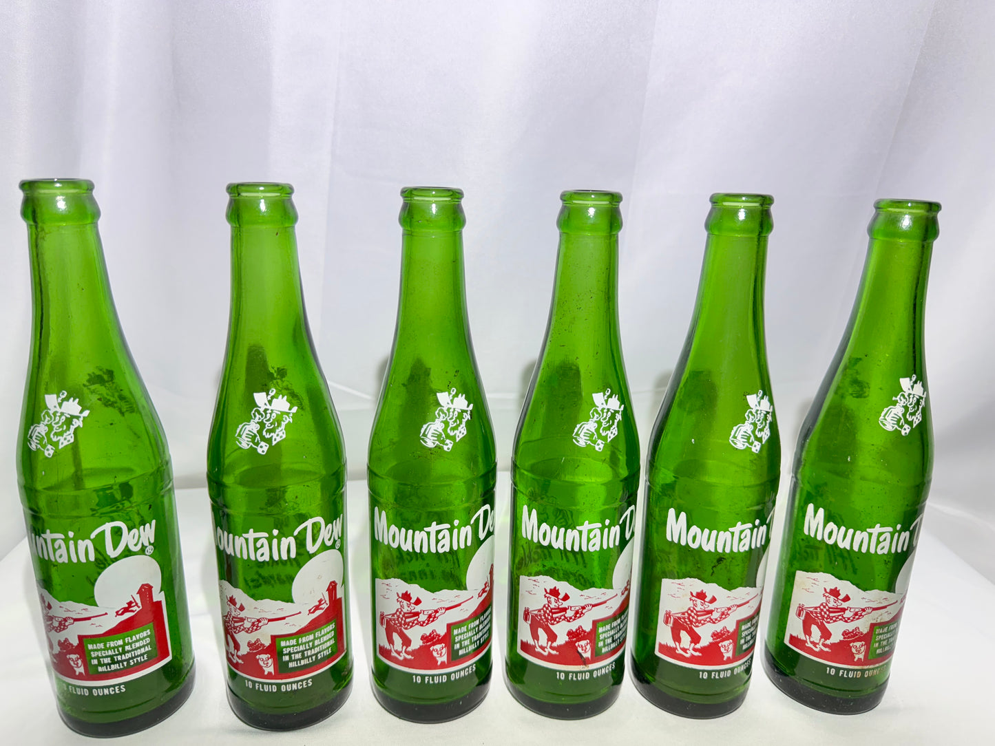 Rare Vintage Mountain Dew Green Glass Bottles – 10 fl oz – Hillbilly Slogan Graphics 6pack