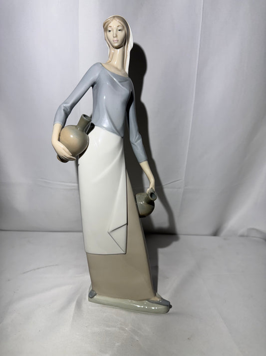 Lladro NAO Porcelain Figurine – “The Jug Carrier” (Water Carrier with Jugs) – Designed by Fulgencio Garcia, 1974