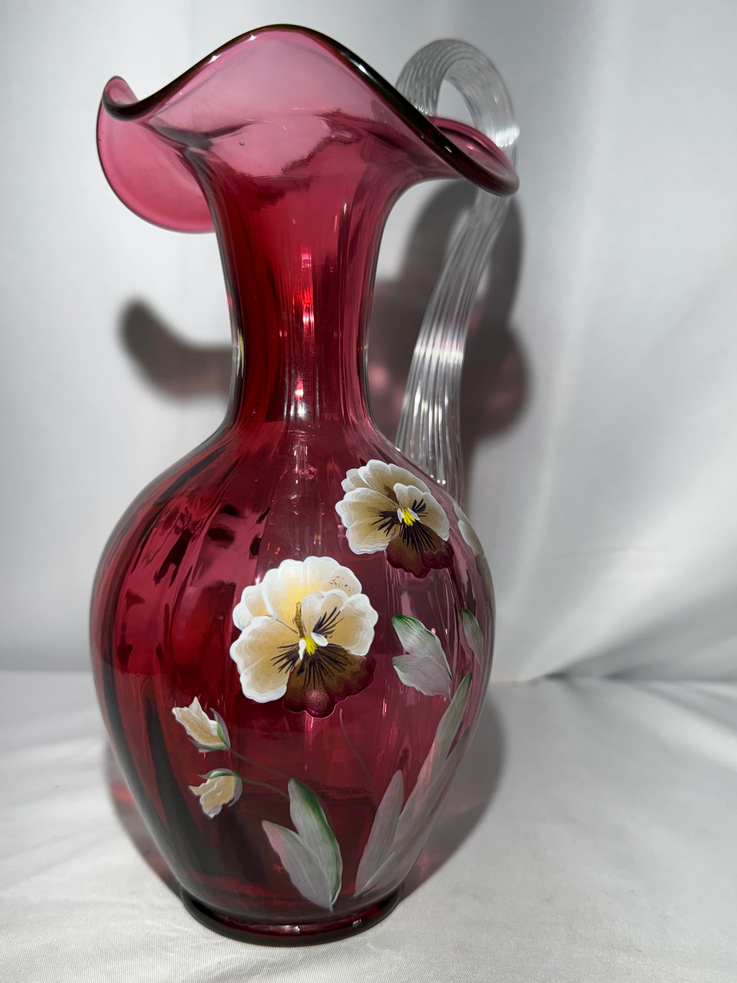 Fenton Art Glass Cranberry “Pansies” Hand-Painted Pitcher – 10.5” Fluted Ribbon Handle