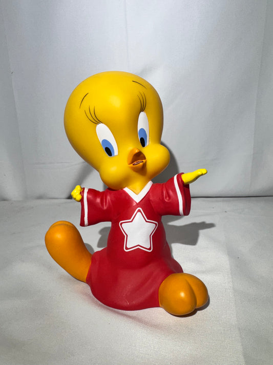 Vintage 1998 Tweety vinyl piggy bank made by Warner Bros.Tweety is wearing a jersey with a star on the front.