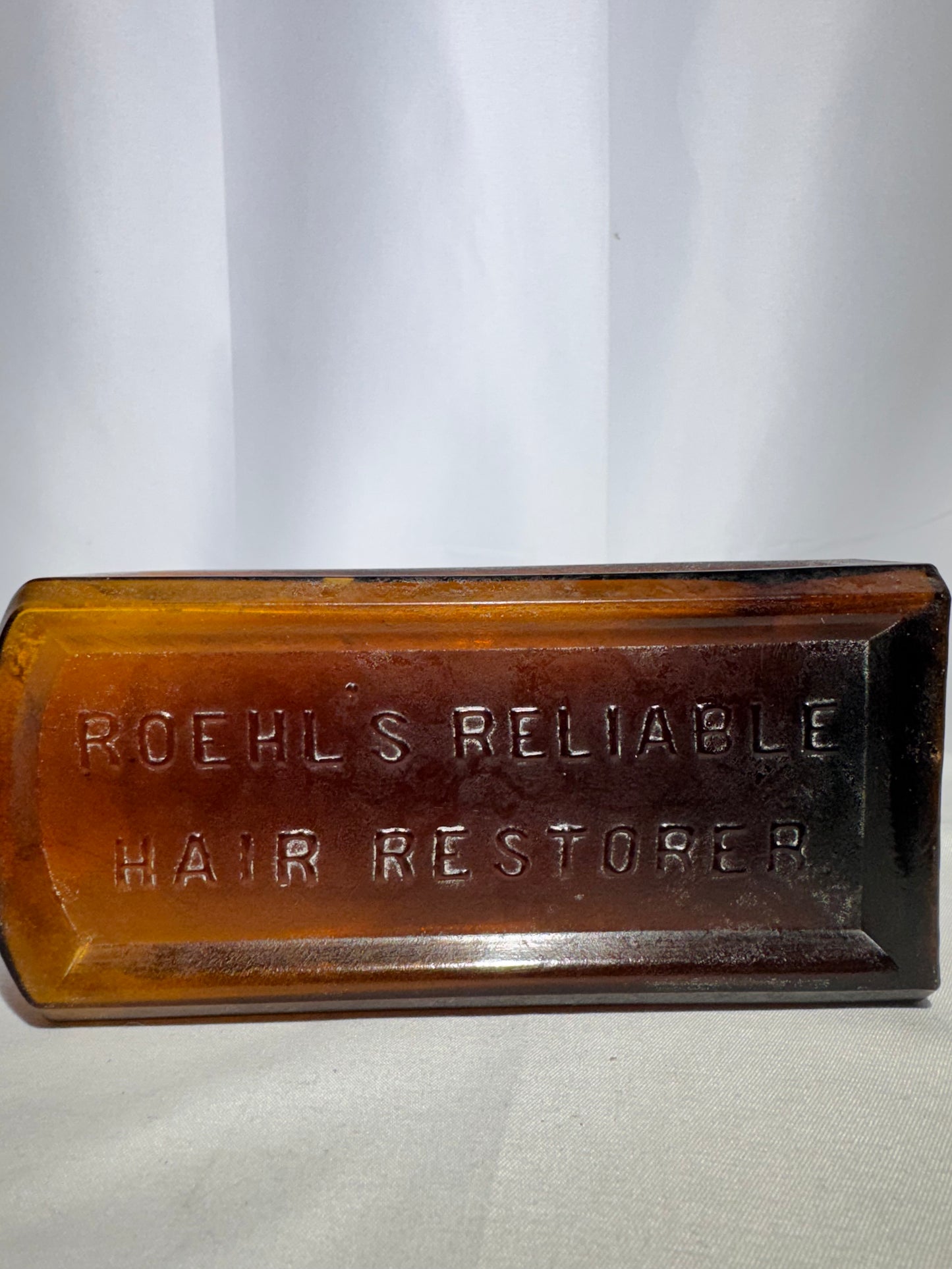 Vintage Amber Glass Apothecary Bottle Roehl’s Reliable Hair Restorer Embossed Antique