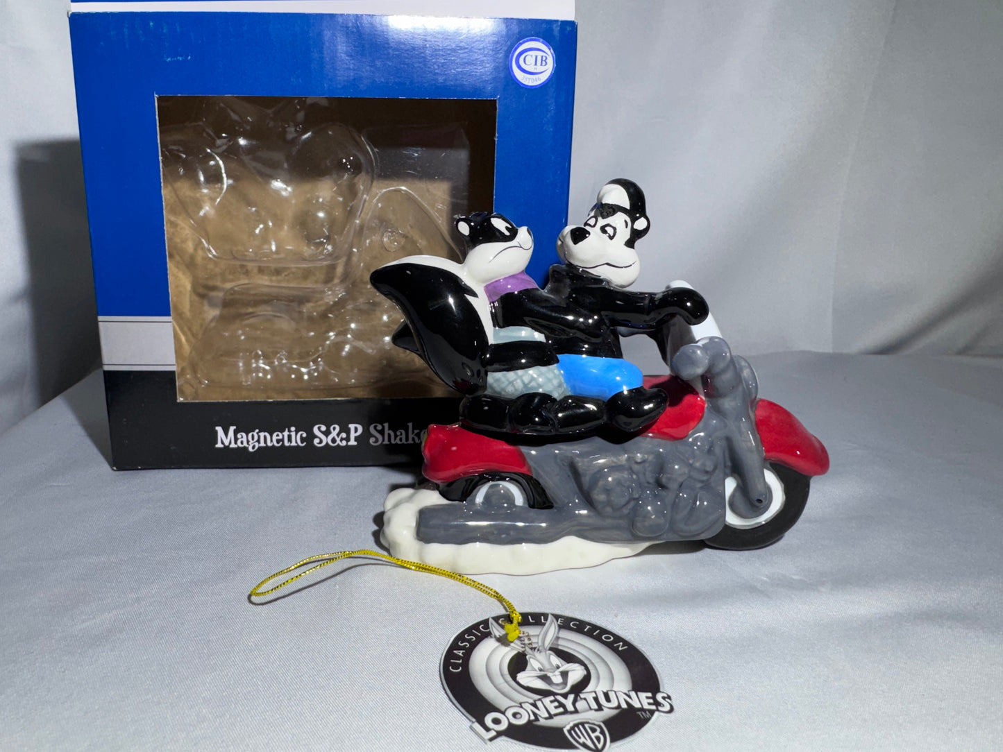 2009 Westland Looney Tunes Pepe Le Pew Penelope and motorcycle Magnetic Shakers Box