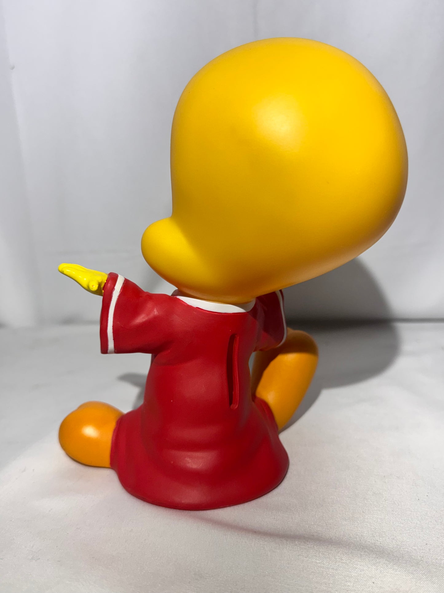 Vintage 1998 Tweety vinyl piggy bank made by Warner Bros.Tweety is wearing a jersey with a star on the front.