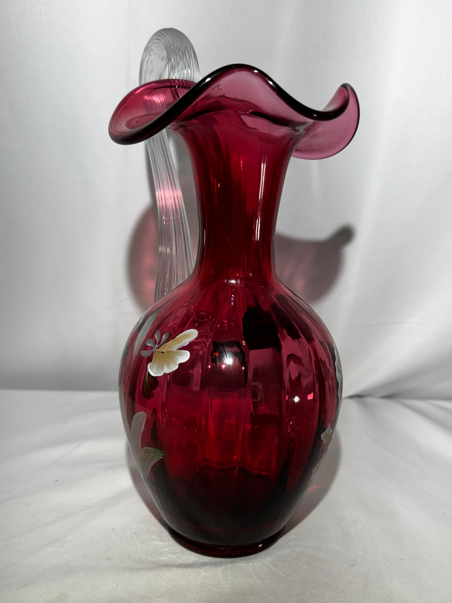 Fenton Art Glass Cranberry “Pansies” Hand-Painted Pitcher – 10.5” Fluted Ribbon Handle