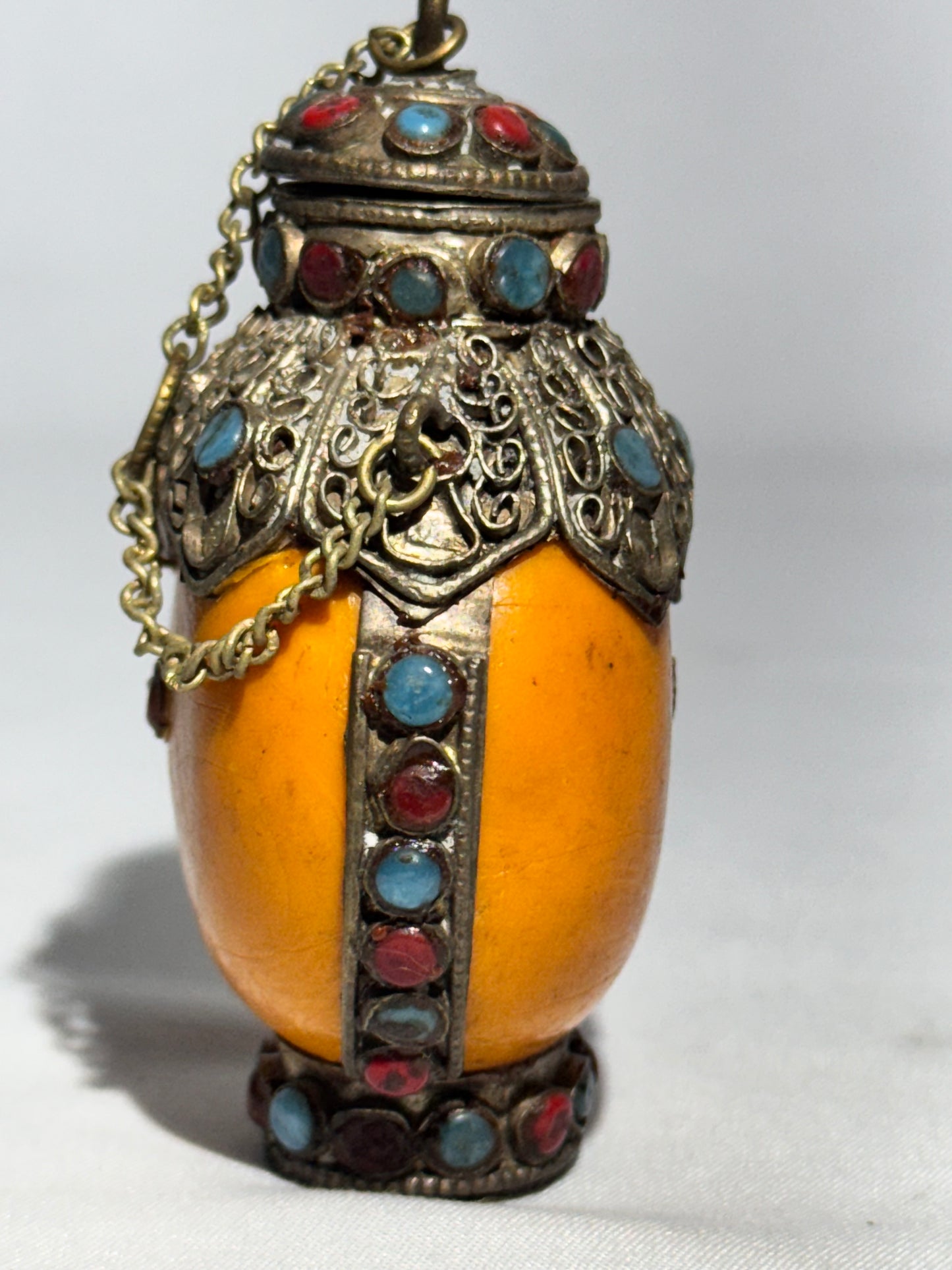 Antique Tibetan Silver Snuff Bottle with Coral and Turquoise Inlay – Ornate Metalwork & Chain Stopper