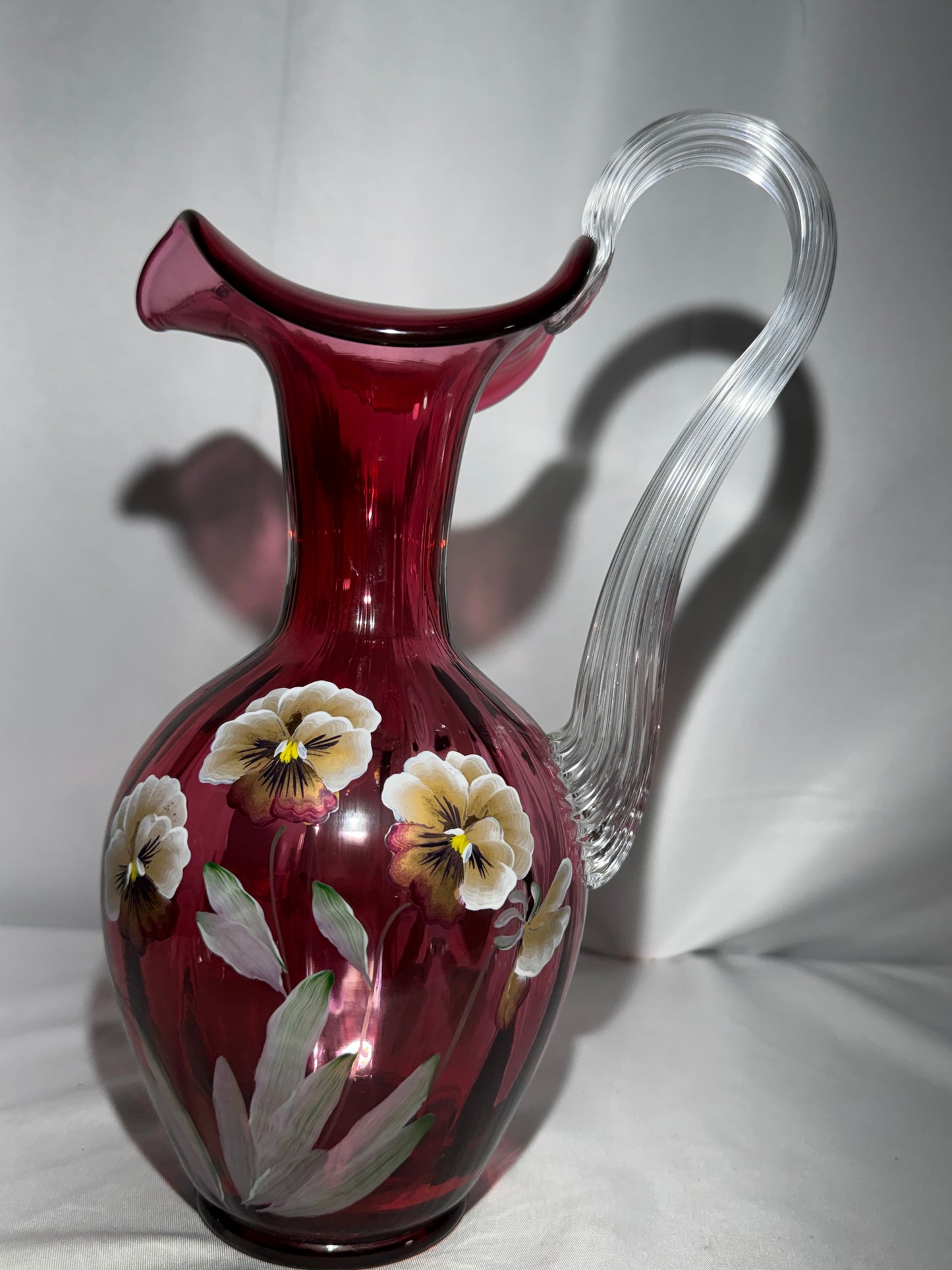 Fenton Art Glass Cranberry “Pansies” Hand-Painted Pitcher – 10.5” Fluted Ribbon Handle