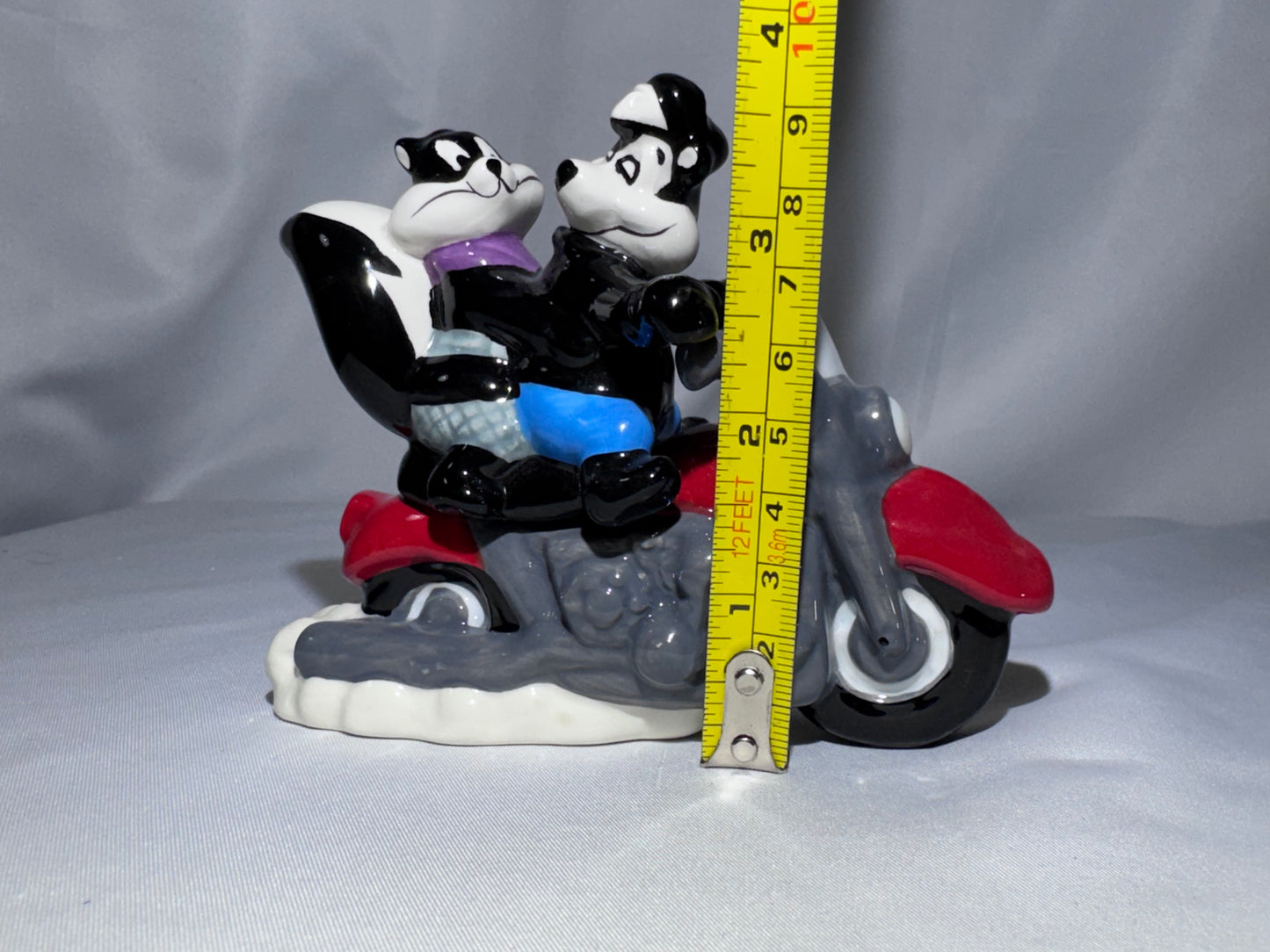 2009 Westland Looney Tunes Pepe Le Pew Penelope and motorcycle Magnetic Shakers Box