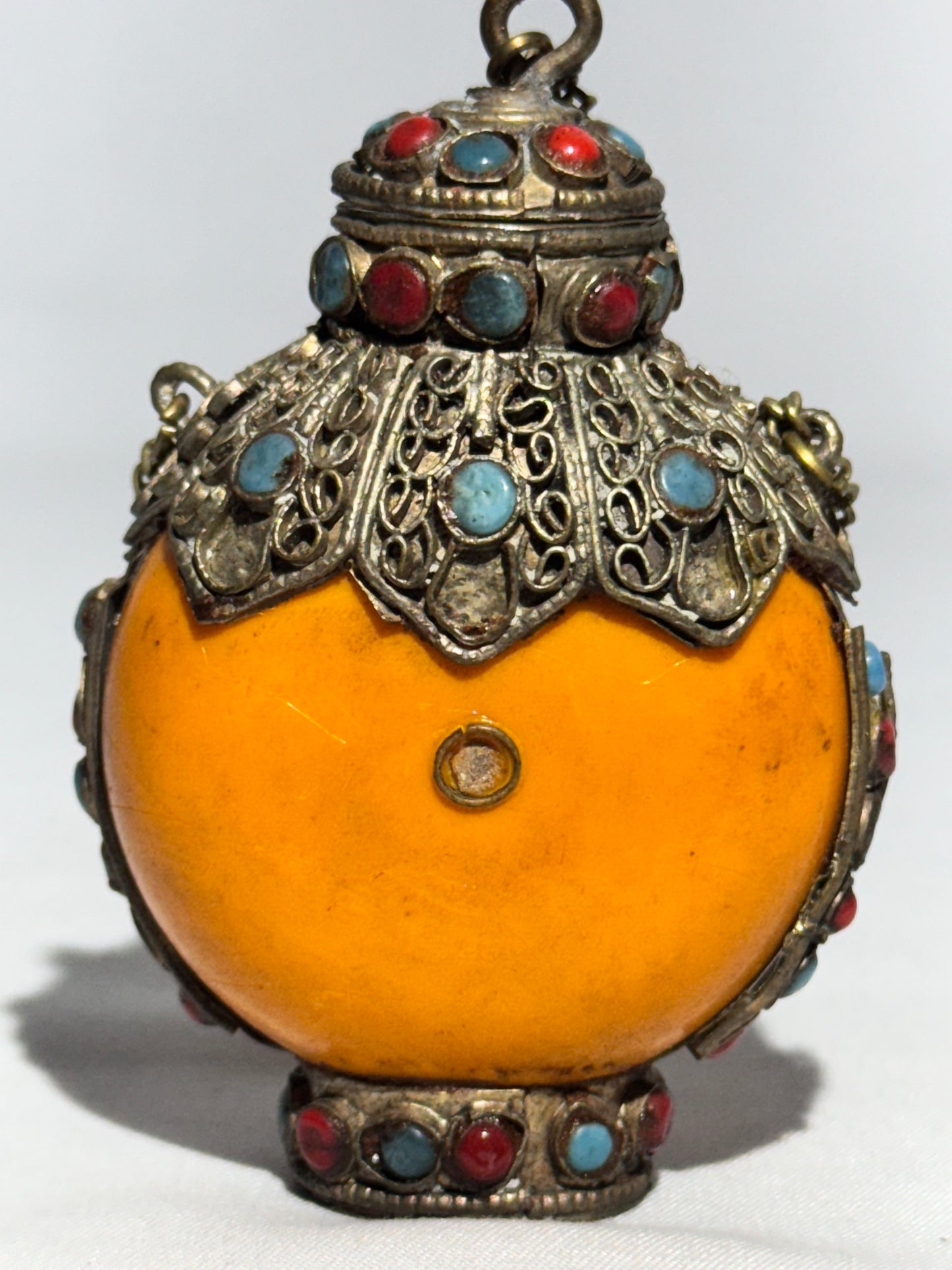 Antique Tibetan Silver Snuff Bottle with Coral and Turquoise Inlay – Ornate Metalwork & Chain Stopper