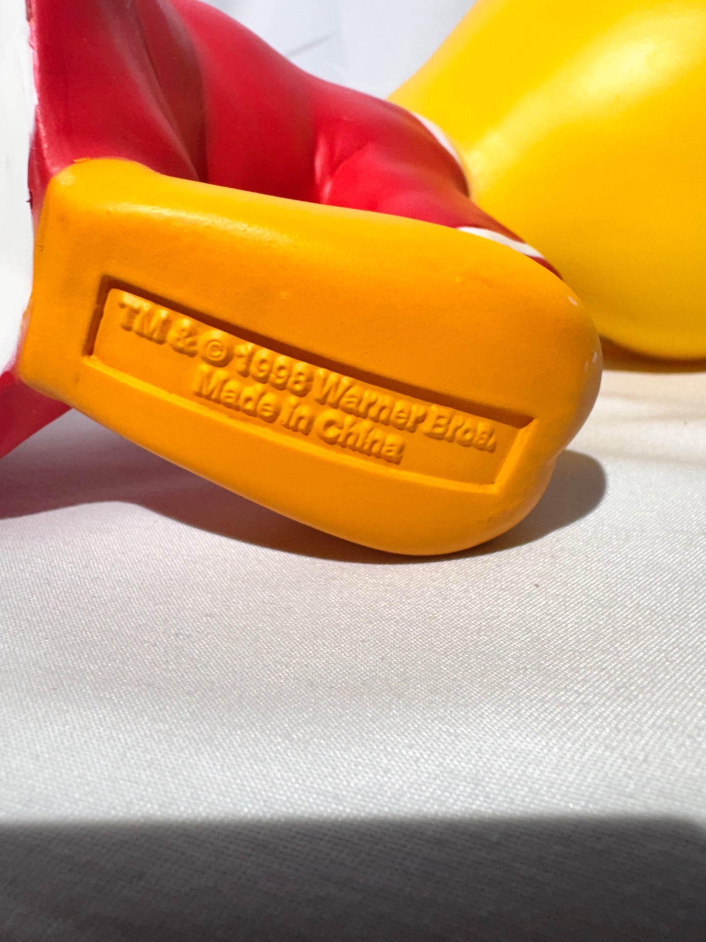 Vintage 1998 Tweety vinyl piggy bank made by Warner Bros.Tweety is wearing a jersey with a star on the front.