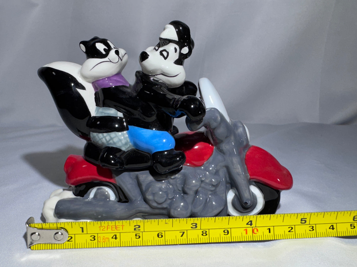 2009 Westland Looney Tunes Pepe Le Pew Penelope and motorcycle Magnetic Shakers Box