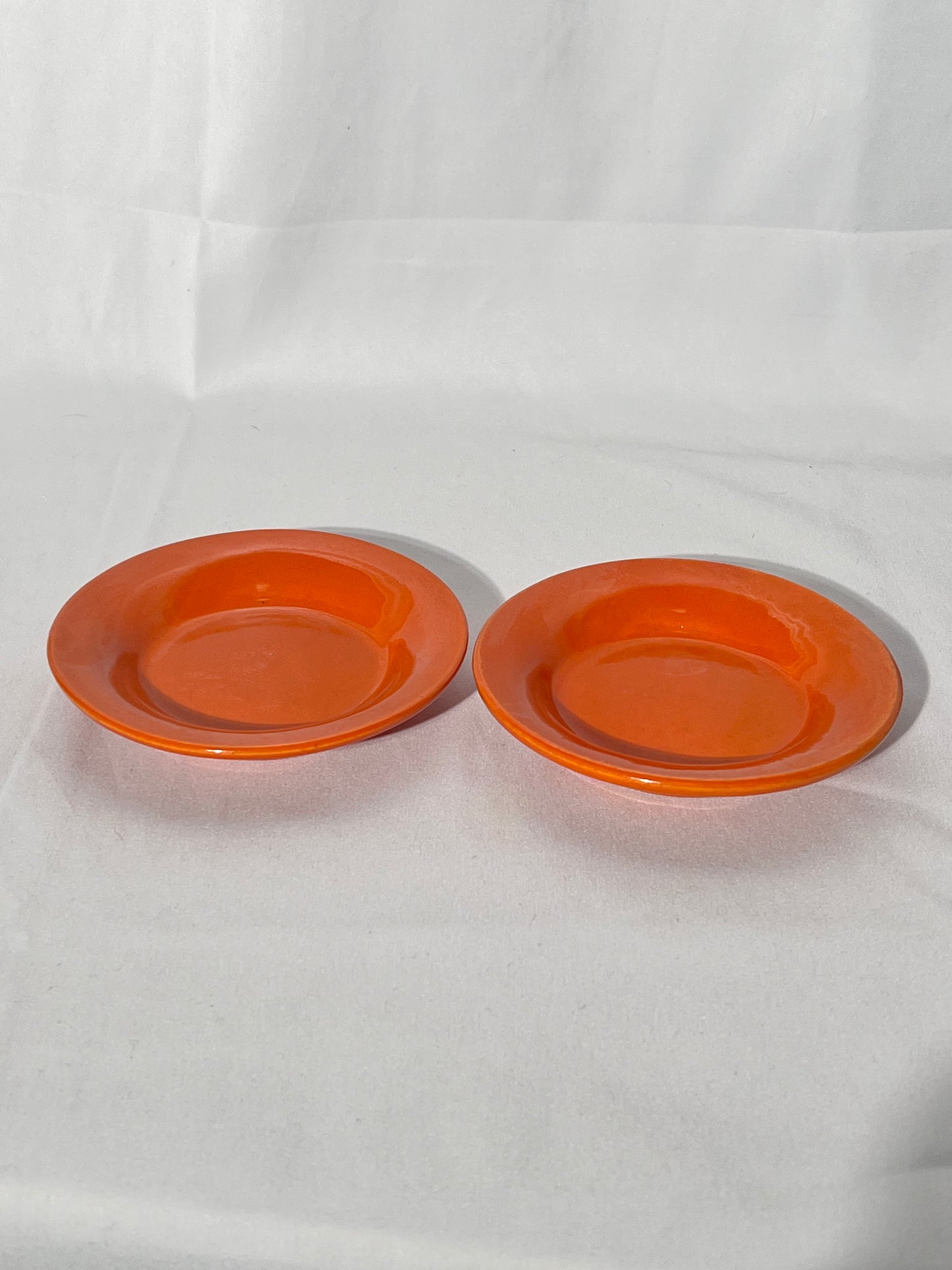 Bauer Pottery- vintage- orange- 4 1/2” saucers - set of 2