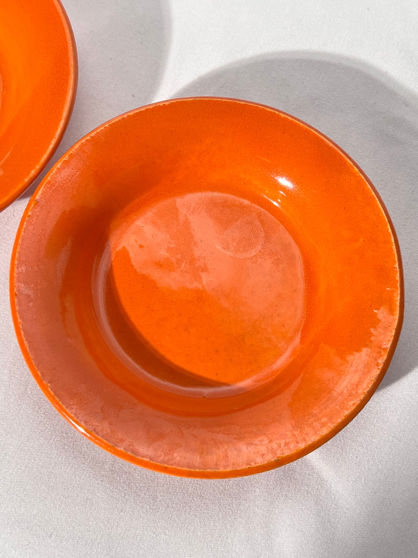Bauer Pottery- vintage- orange- 4 1/2” saucers - set of 2