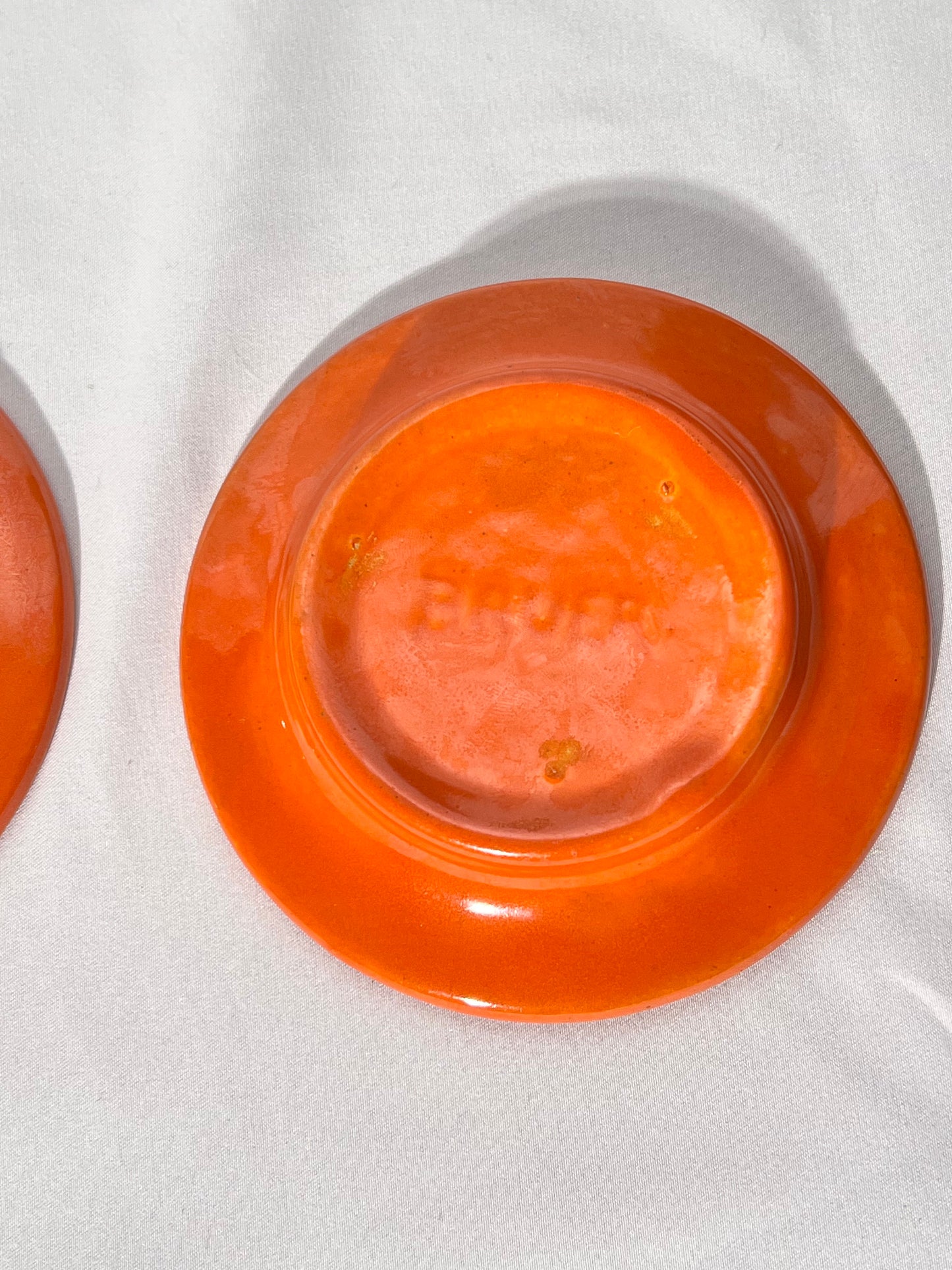 Bauer Pottery- vintage- orange- 4 1/2” saucers - set of 2