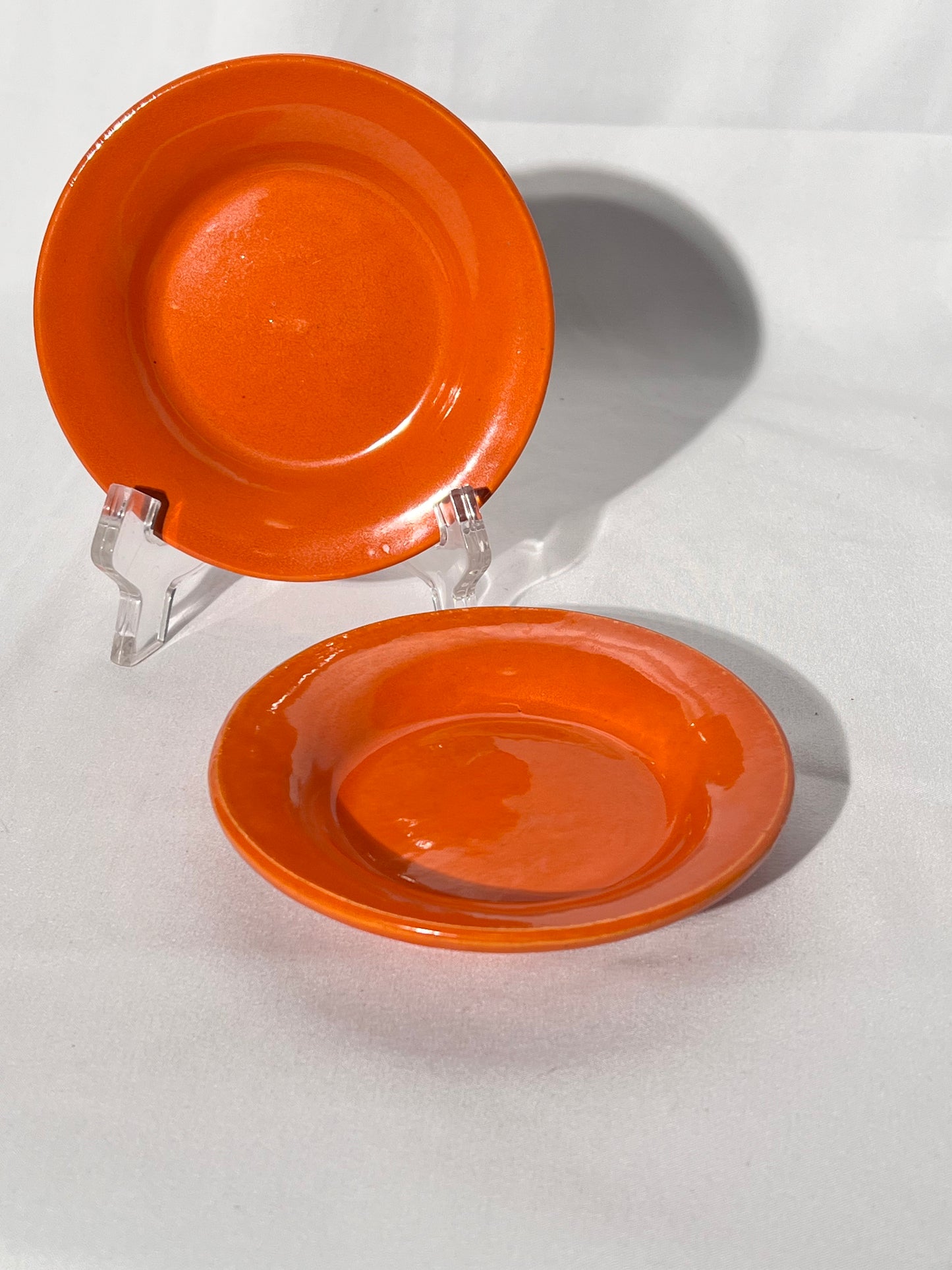 Bauer Pottery- vintage- orange- 4 1/2” saucers - set of 2