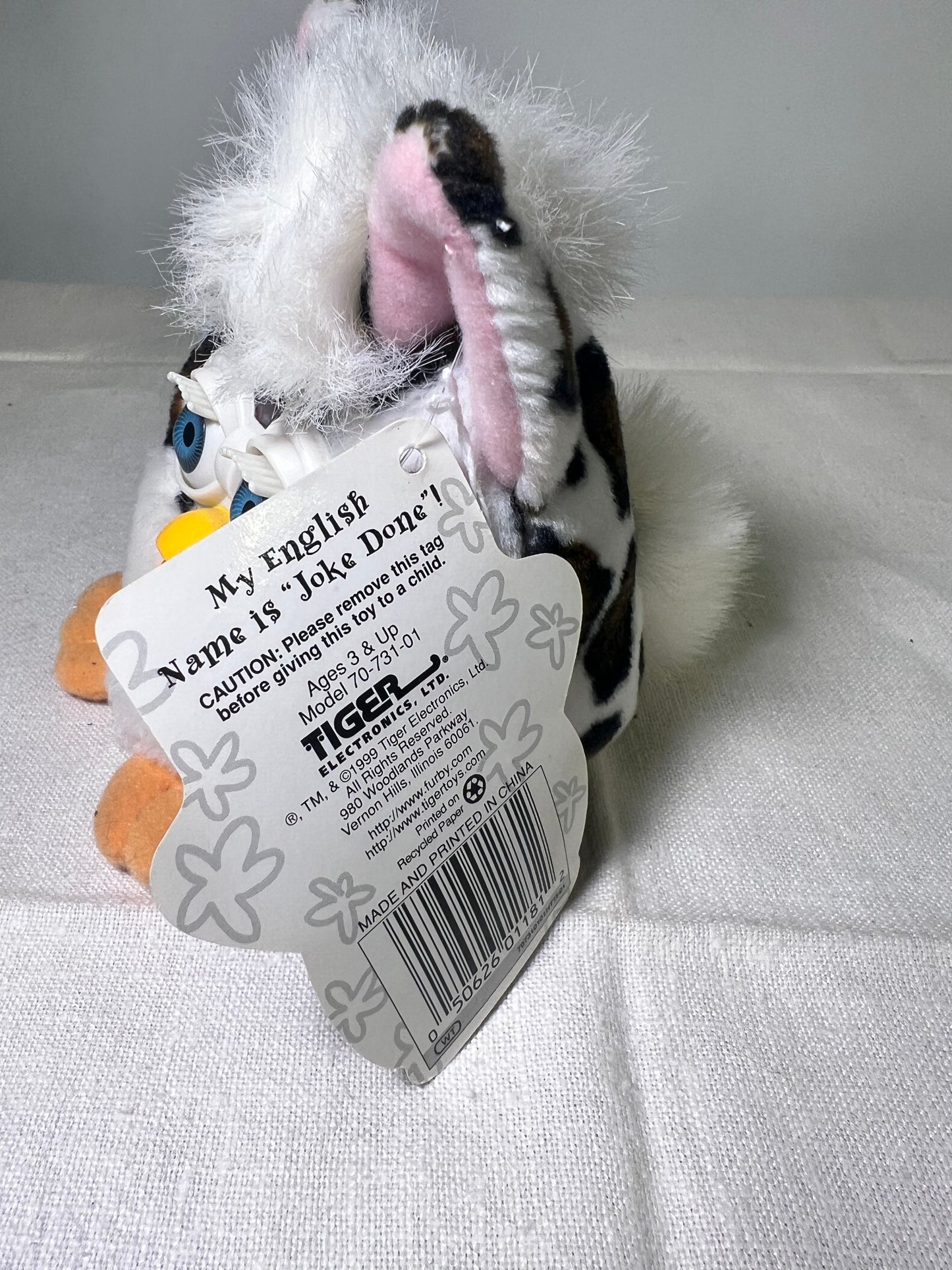 Furby Buddies-Joke Done- 1999- Tiger Electronics- white with brown and black spots- Blue Eyes