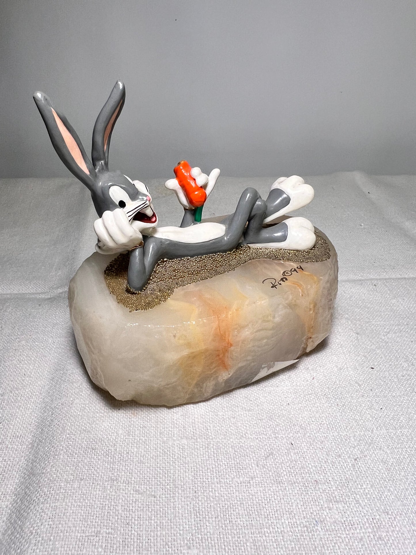 Ron Lee - Bugs Bunny- 4” statue - laying with a carrot- signed and numbered 517\1200- 1993-stone base-Looney Tunes-Warner Brothers