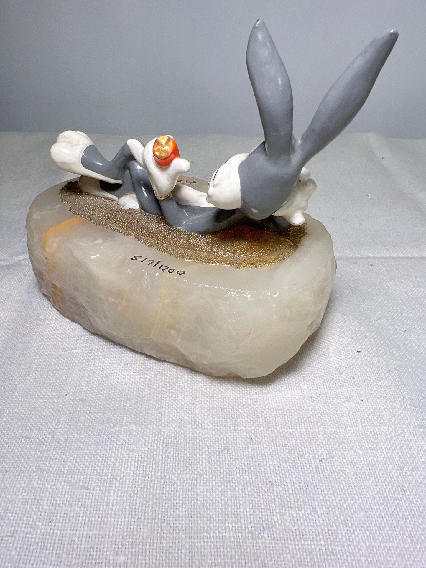 Ron Lee - Bugs Bunny- 4” statue - laying with a carrot- signed and numbered 517\1200- 1993-stone base-Looney Tunes-Warner Brothers