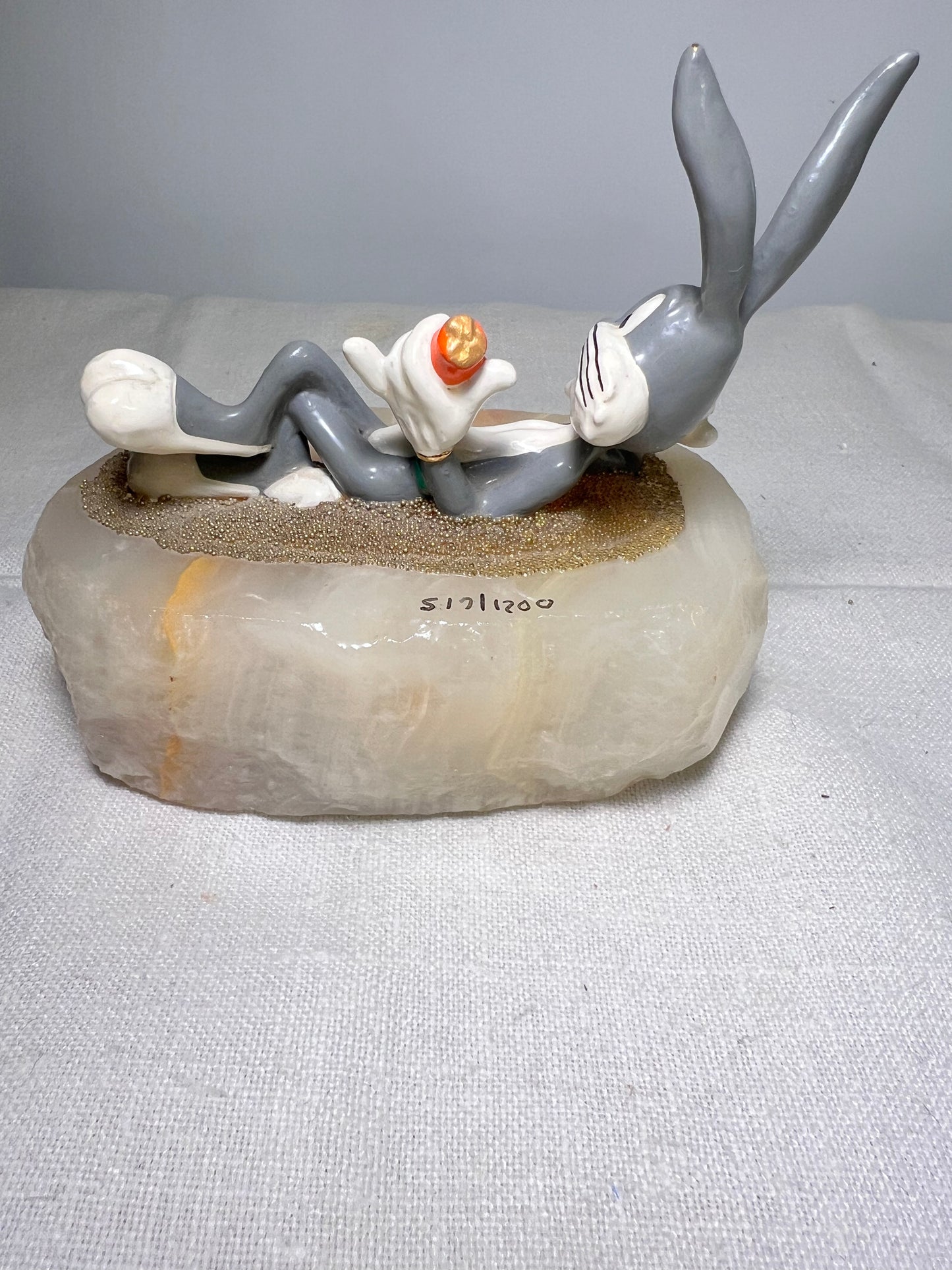 Ron Lee - Bugs Bunny- 4” statue - laying with a carrot- signed and numbered 517\1200- 1993-stone base-Looney Tunes-Warner Brothers