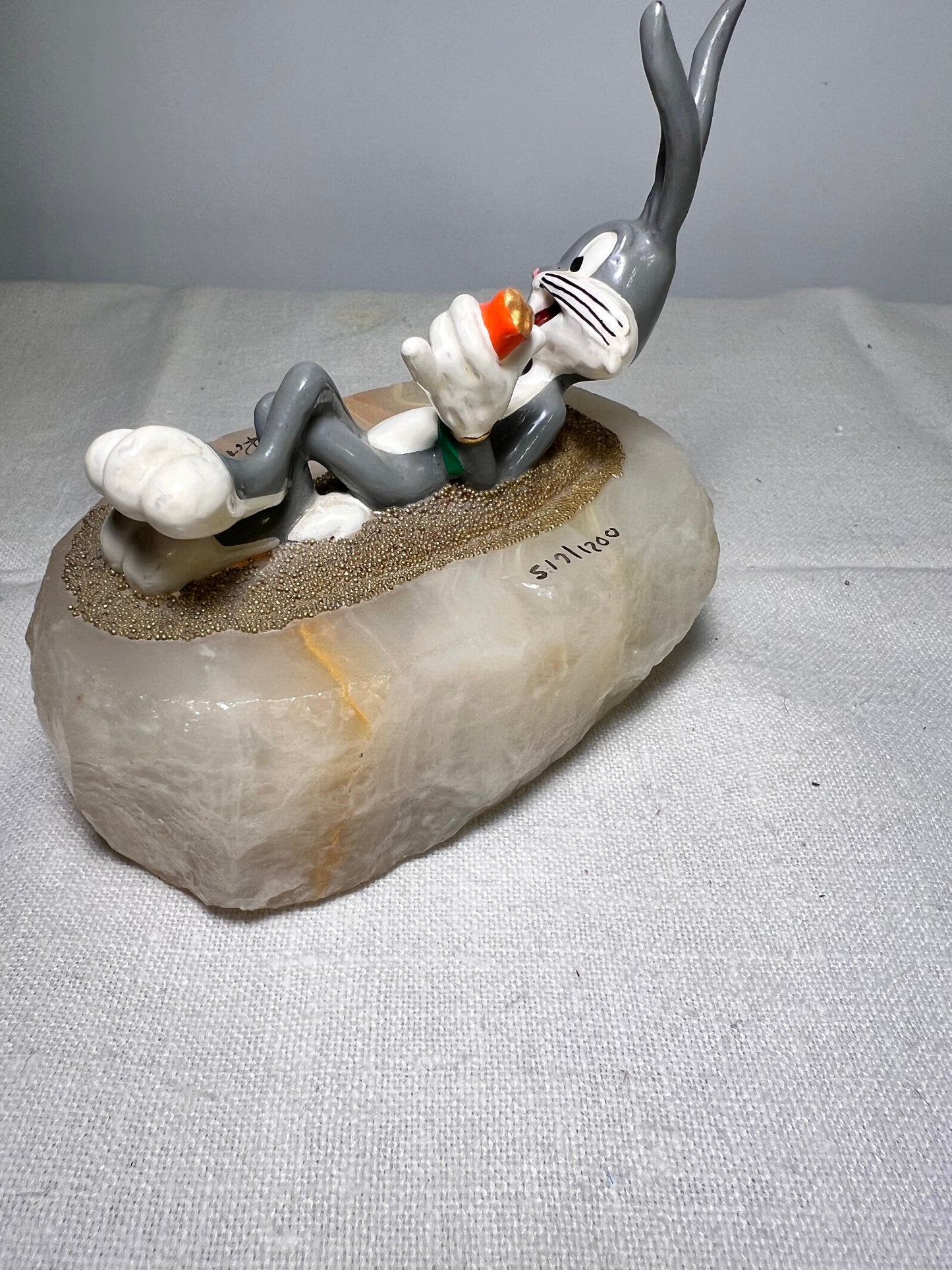 Ron Lee - Bugs Bunny- 4” statue - laying with a carrot- signed and numbered 517\1200- 1993-stone base-Looney Tunes-Warner Brothers