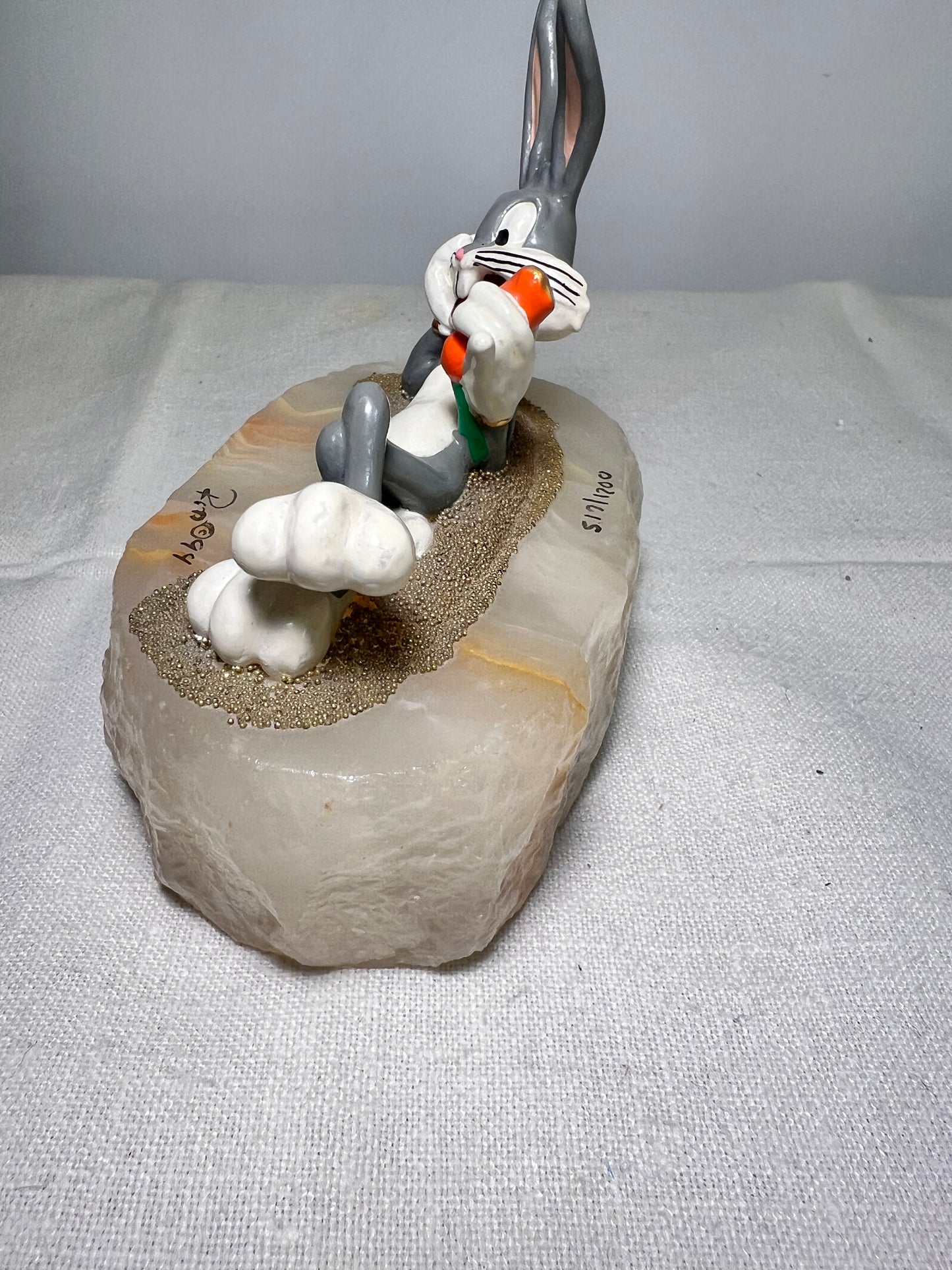 Ron Lee - Bugs Bunny- 4” statue - laying with a carrot- signed and numbered 517\1200- 1993-stone base-Looney Tunes-Warner Brothers