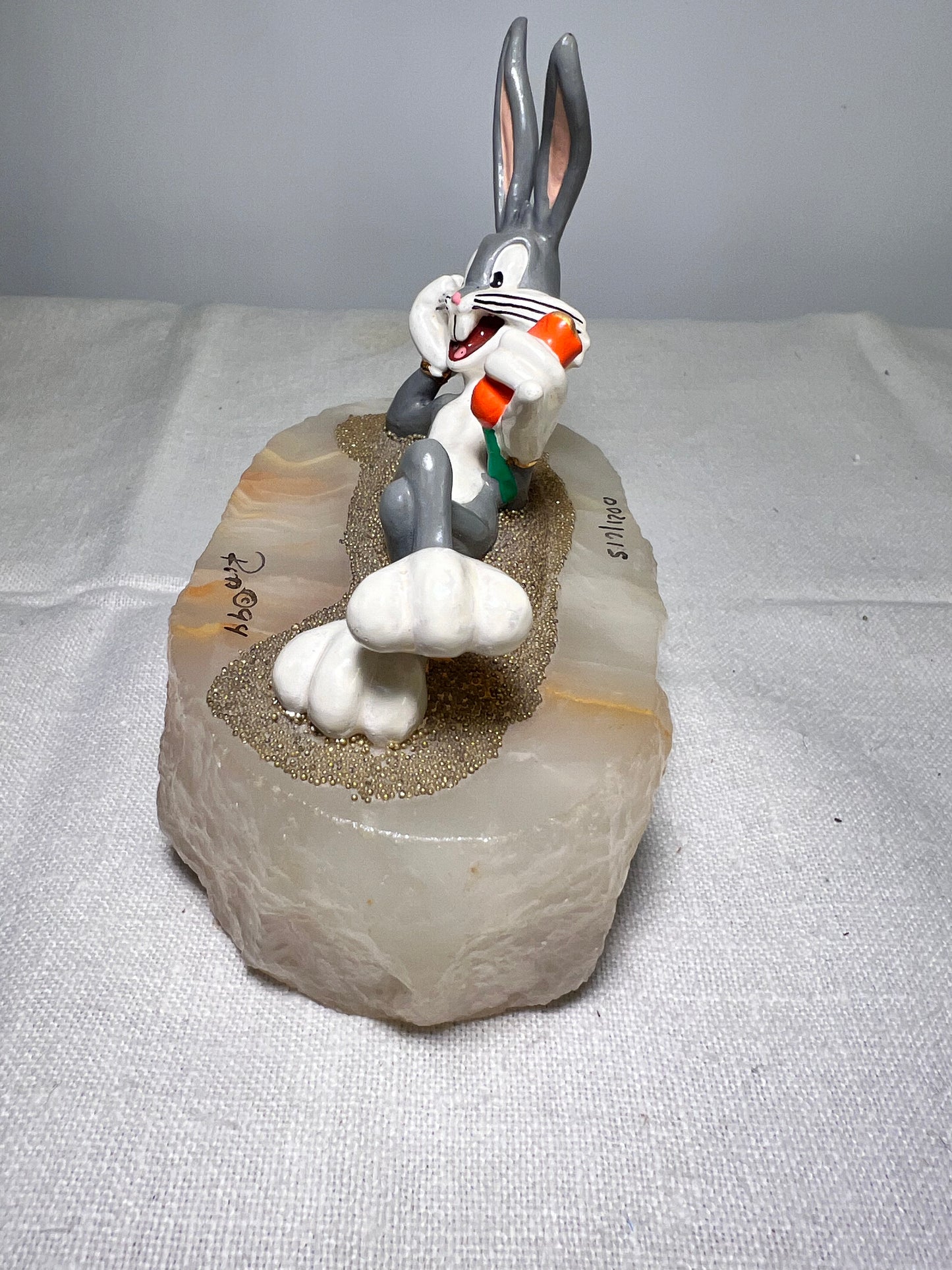 Ron Lee - Bugs Bunny- 4” statue - laying with a carrot- signed and numbered 517\1200- 1993-stone base-Looney Tunes-Warner Brothers