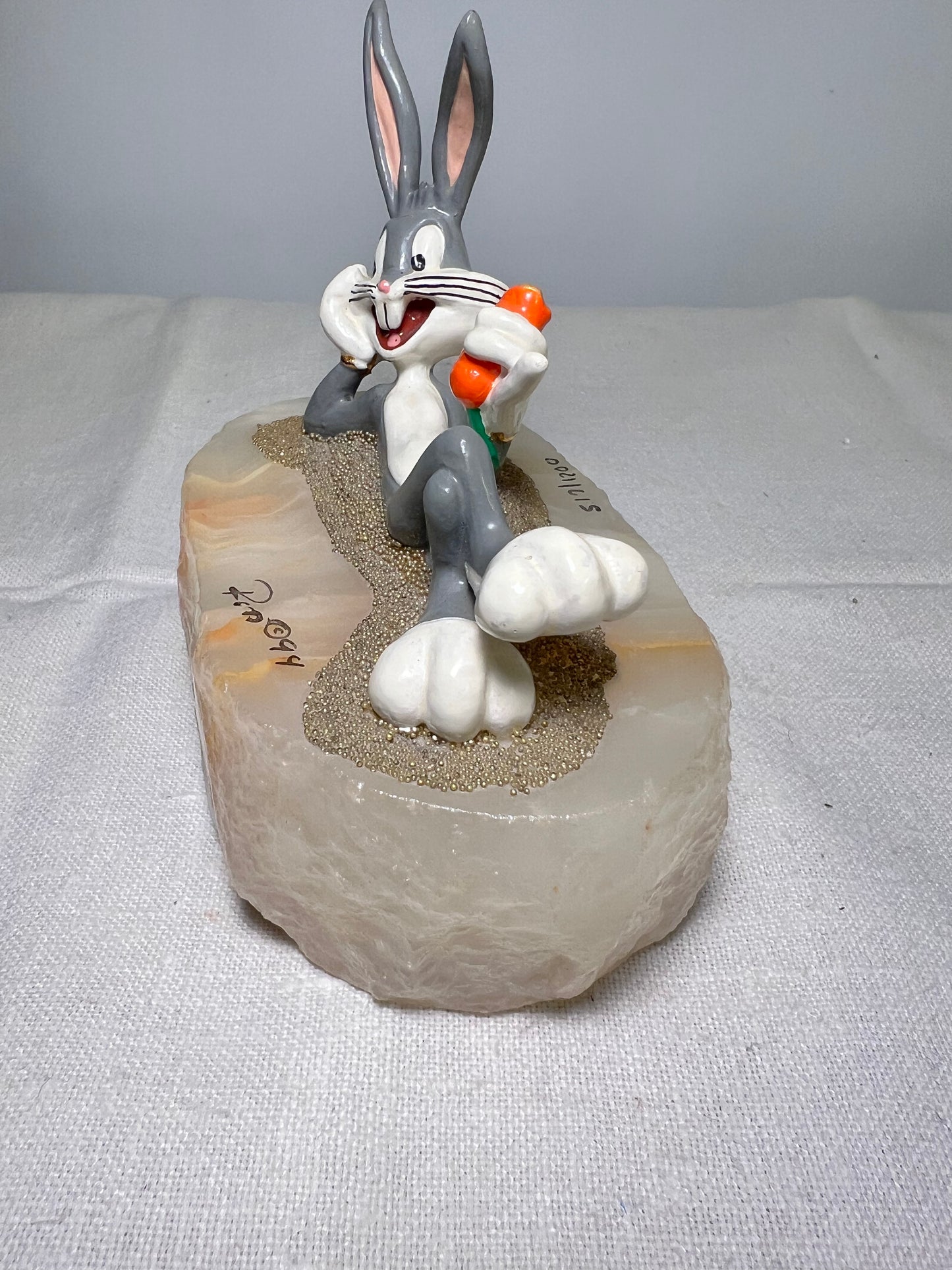 Ron Lee - Bugs Bunny- 4” statue - laying with a carrot- signed and numbered 517\1200- 1993-stone base-Looney Tunes-Warner Brothers