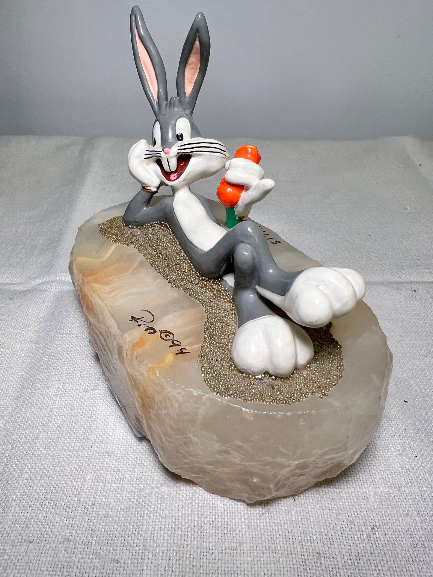 Ron Lee - Bugs Bunny- 4” statue - laying with a carrot- signed and numbered 517\1200- 1993-stone base-Looney Tunes-Warner Brothers