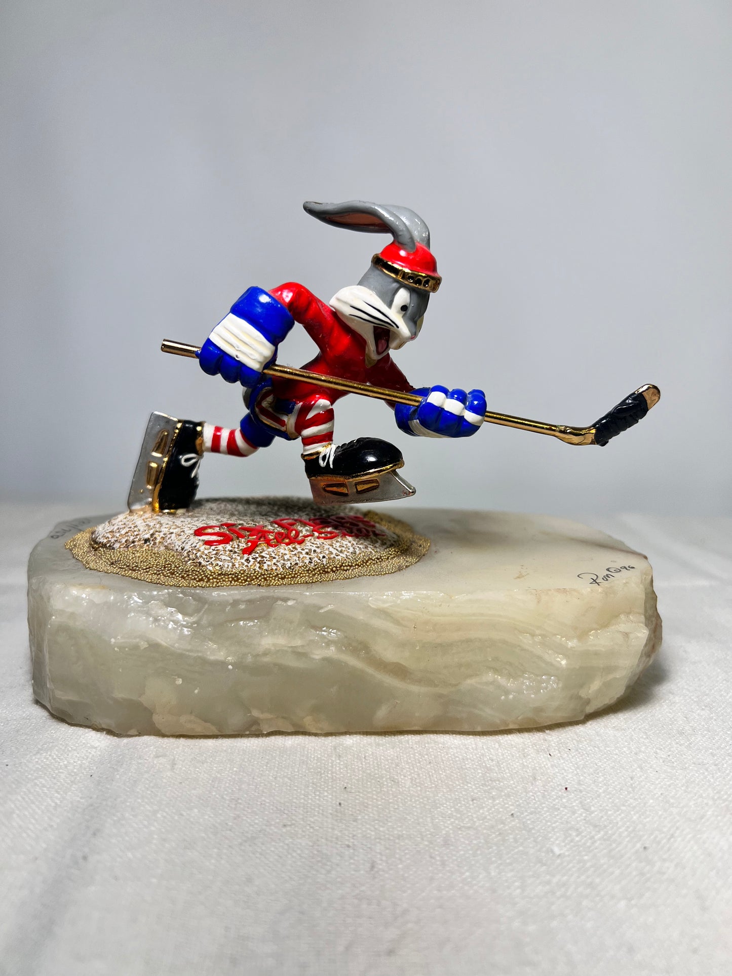 Ron Lee- Bugs Bunny- playing hockey-six flags- signed and numbered 124/750- Looney Tunes-1996- Stone base