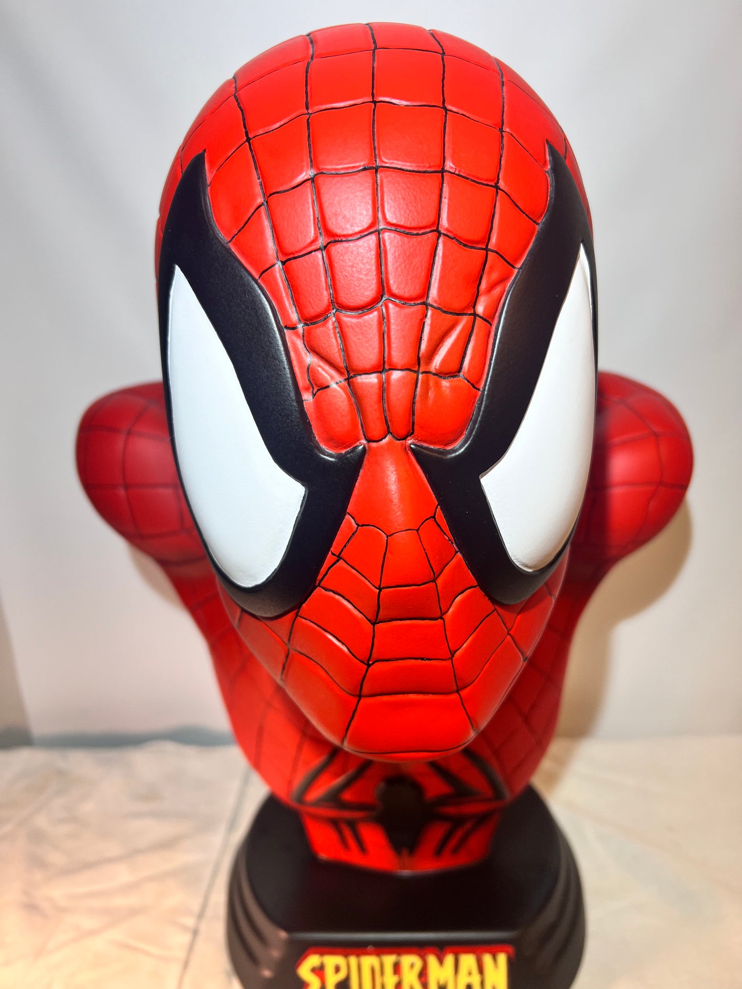 Spider Man- 21.5” bust- Red Suit, black spider, Blue back- Black base with Spider Man logo- Hollow Plastic Resin