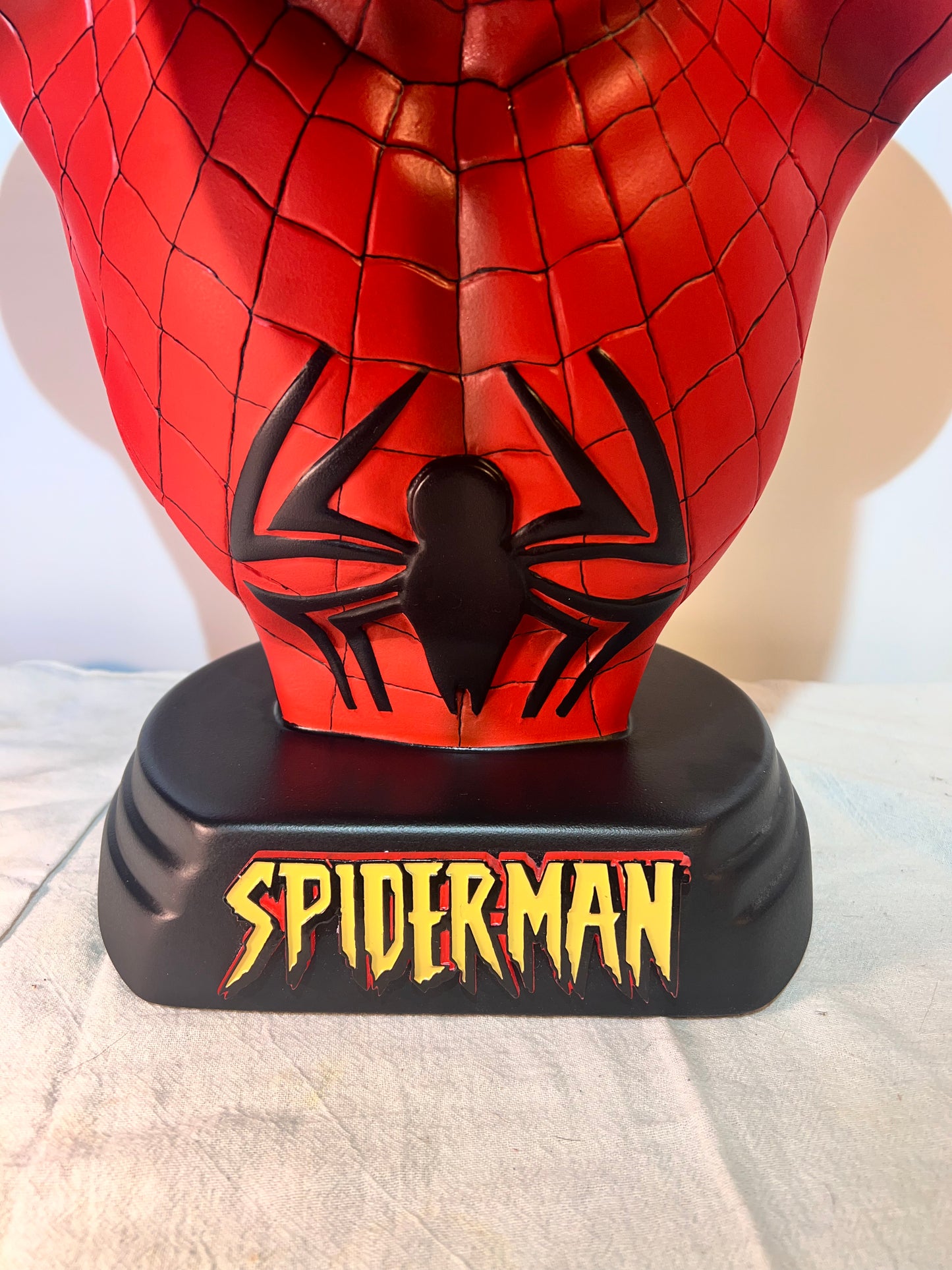 Spider Man- 21.5” bust- Red Suit, black spider, Blue back- Black base with Spider Man logo- Hollow Plastic Resin