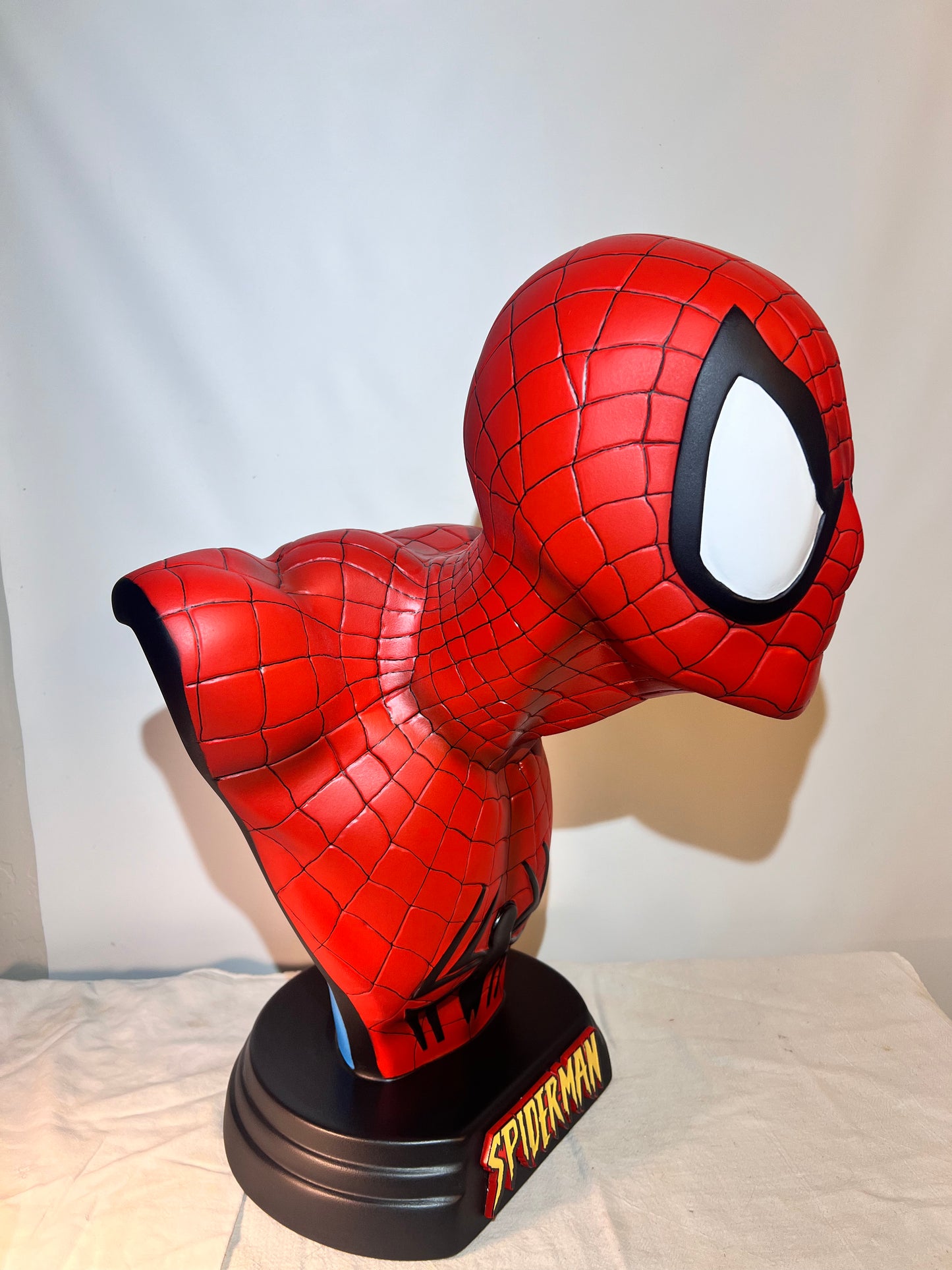 Spider Man- 21.5” bust- Red Suit, black spider, Blue back- Black base with Spider Man logo- Hollow Plastic Resin