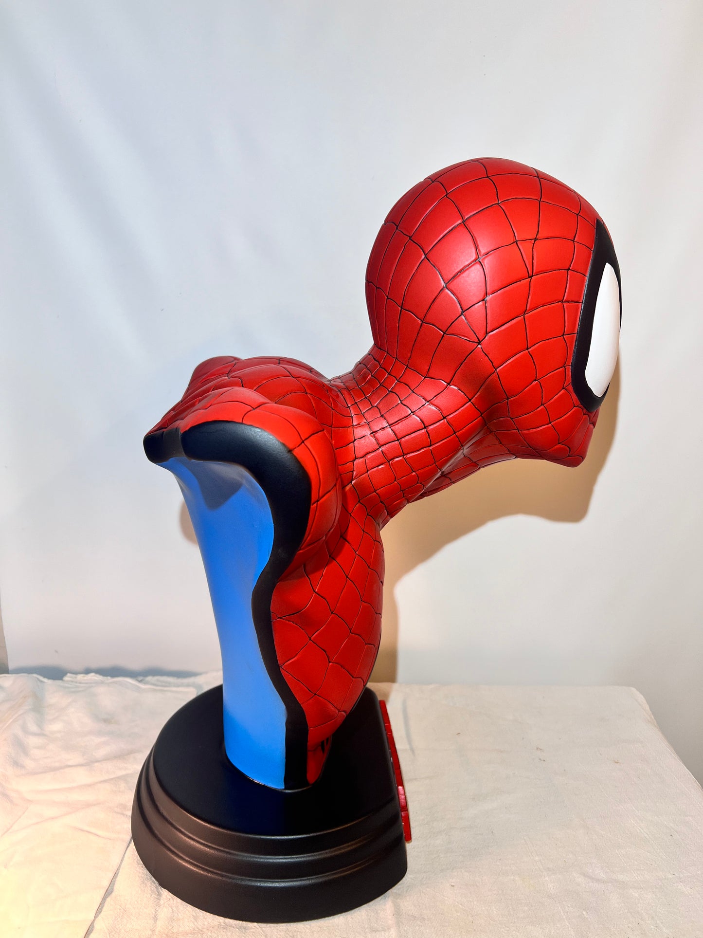 Spider Man- 21.5” bust- Red Suit, black spider, Blue back- Black base with Spider Man logo- Hollow Plastic Resin