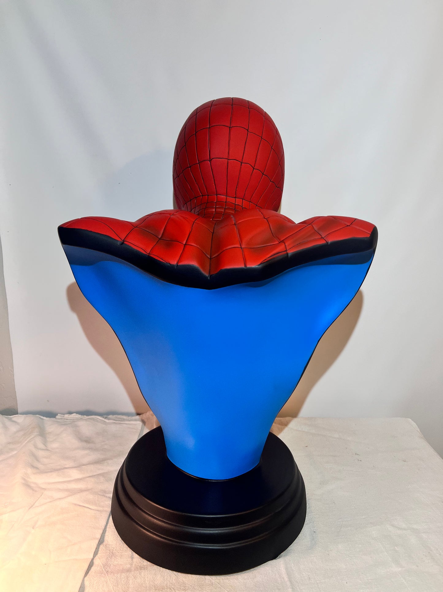 Spider Man- 21.5” bust- Red Suit, black spider, Blue back- Black base with Spider Man logo- Hollow Plastic Resin